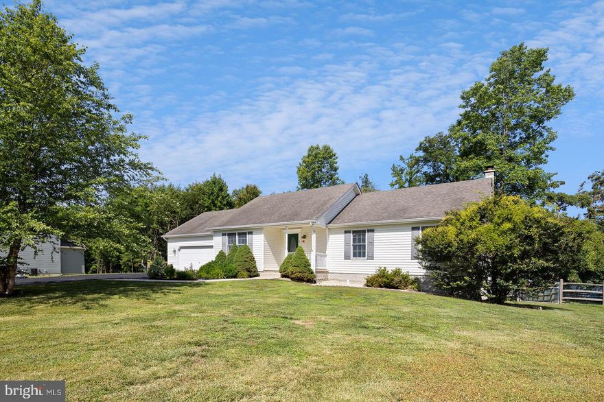 Located in the water oriented/access community of Harbour View, this beautiful ranch home has outstanding value and embodies a more casual lifestyle. Open floor plan connects the common spaces for both entertaining and everyday living. Covered front porch entrance leads to an unexpected, vaulted ceiling and handsome wood vinyl plank floors. Spacious eat-in kitchen has loads of natural wood cabinets with crown molding, stainless appliances, built-in microwave, double sink, pantry cabinets for added storage and pendant lighting. Plenty of room for large table next to charming built-in hutch. Breakfast bar seats four comfortably. Great room has skylights, propane gas fireplace and sliders to deck with wide stairway to huge, fenced backyard surrounded by mature trees with big shed for storage. Primary bedroom has walk-in closet and separate bath with double sink vanity and tile floor. Two other bedrooms, hall bath with tub/shower and tile floor and laundry closet with tub complete the first floor. Finished walk-out basement has multiple finished spaces. Cozy family room with handsome built-ins and wood burning stove, bonus room currently used for games, hall bath with tile floor and a fourth bedroom with sliders out to the backyard. There is also a large unfinished room for storage. Other highlights include oversized two-car garage and ceiling fans in all bedrooms. Community features a picnic area, sandy beach, boat ramp and wonderful water views. Just a few minutes away are numerous shops, restaurants and attractions in the Chesapeake City historic area along the C&D Canal. Great home. Unique community. Extraordinary hometown.