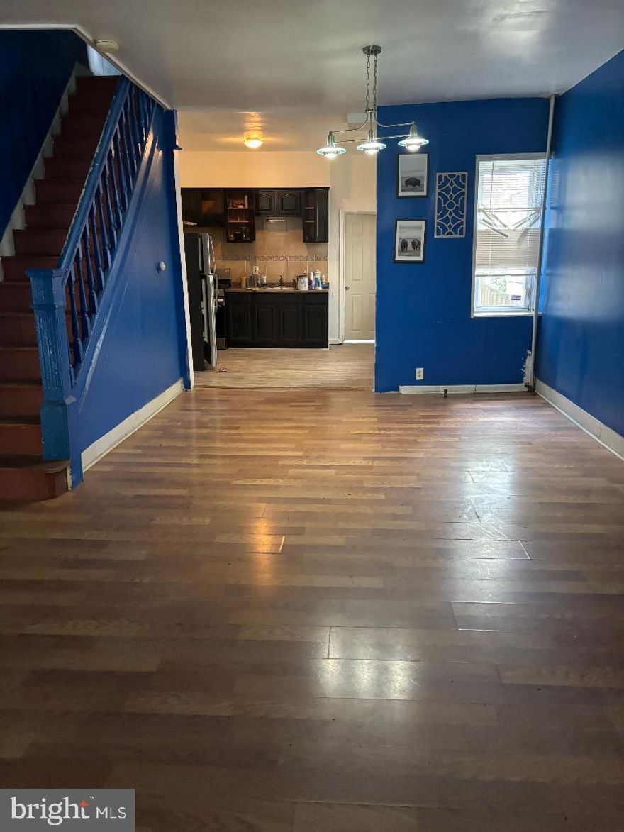 Very nice townhouse close to everything.  3 bedrooms and full bath on 2nd floor.  Enclosed front porch with heat and seperate door going into a spacious open concept consisting of a large combo living room and dining room and into a lovely newer kitchen with breakfast bar.  Seperate door off kitchen to the 1st floor laundry room and possible family room with rear door going out to a big fenced rear yard. Full basement.