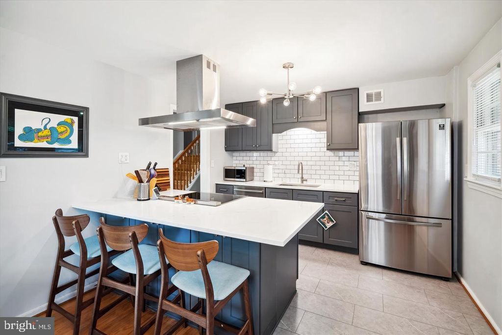 Photo of 5907 85th Ave, NEW CARROLLTON, MD 20784 (MLS # MDPG2177114)
