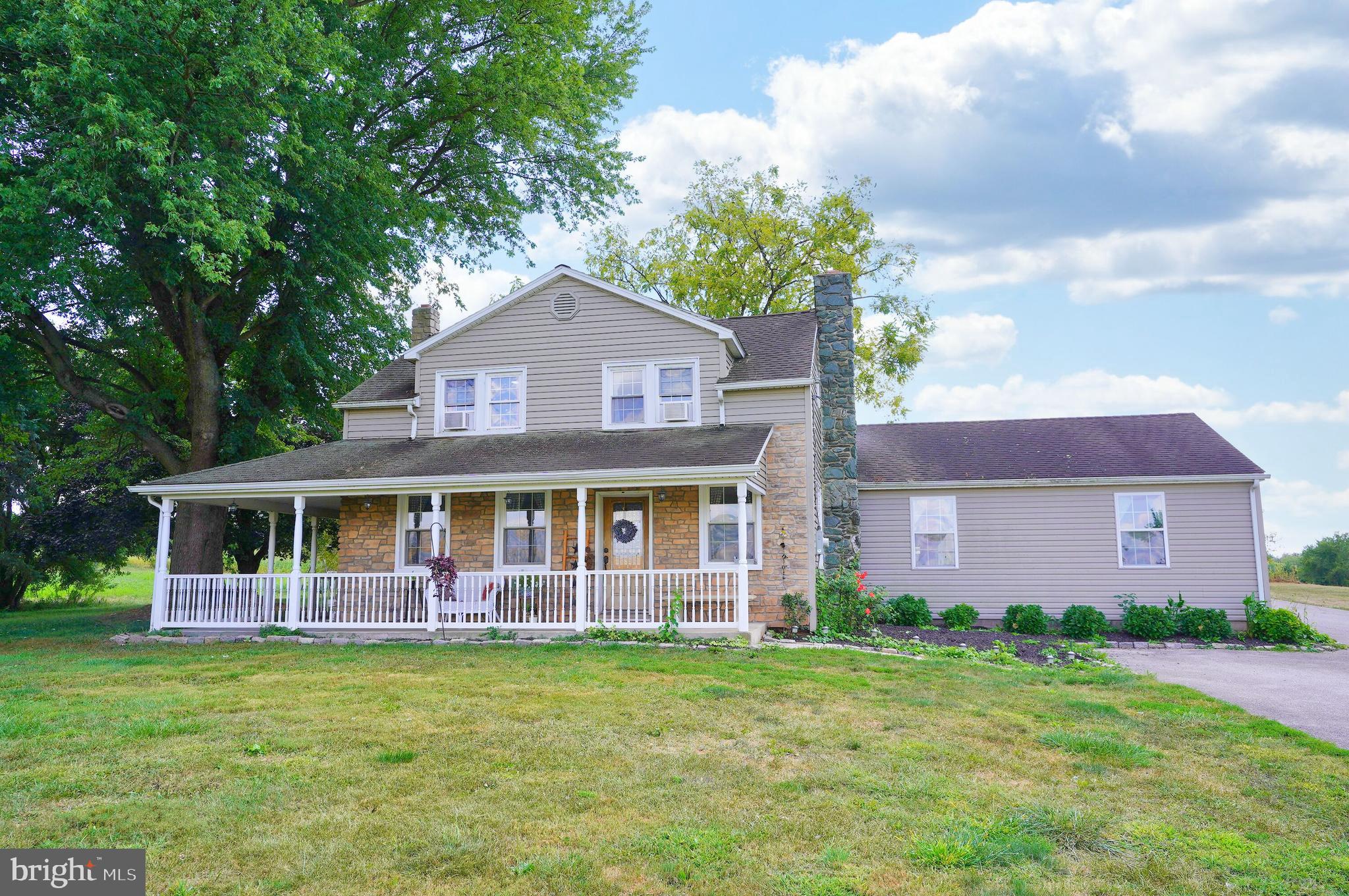 This is a one-of-a-kind property featuring a 4000+ sq.ft, 6-bedroom home with fabulous, open living spaces; a separate & versatile 40’x60’ workshop/building; 11.6 acres with bank barn and additional outbuildings; and a gorgeous 1-acre pond. Originating in the pre-civil war era of the early 1860’s (est.), this historic log home has been restored to accent the beautiful original construction, along with the substantial addition added, approx. 15-20 years ago. This versatile and spacious home is highlighted by a huge living room with a wood stove, an open & bright recreation room, a library with pocket-doors, cathedral ceiling and built-in shelving, an open master suite with interior balcony, and the spacious country kitchen with the original fireplace (converted to propane), a huge kitchen island, quartz counters and room for the big dining room table to enjoy large family meals. The workshop is a hobbyist’s dream with a 3-bay independent shop, separate electric, water, 16’ ceilings, 14’ garage doors, concrete floor, with lots of potential uses. And then there is the setting; a beautiful 11.6 acres, bank barn, misc utility outbuildings and the picturesque pond, recognizable by passers-by for decades, ready for fishing, a small boat, or as a tranquil place to relax. This is an exceptional opportunity, after addressing some deferred maintenance, to own a truly magnificent property.