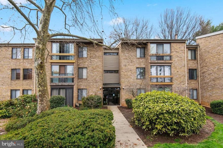 Nestled in the established community of Columbia, Maryland, this 2-bedroom, 1.5-bath ground floor condominium offers comfortable, low-maintenance living with thoughtful updates throughout. The kitchen and bathrooms have been tastefully updated, complemented by new flooring and modern appliances. The primary bedroom features a walk-in closet. A wood-burning fireplace anchors the living space. A light-filled transition room with painted brick walls and tile flooring connects the interior living space to the private rear patio — equally suited as a sitting area, home office, or entry foyer leading to the outdoors. Laundry facilities are available within the building. The monthly HOA fee of $427 covers water, sewer, trash, exterior maintenance, roof, and grounds maintenance. Situated in Howard County, Maryland — long recognized for its planned community design, green spaces, and convenient access to major corridors including Route 29 and Interstate 95.
