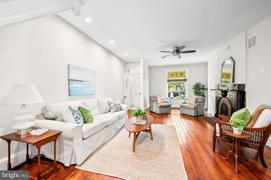 Looking for more space? This classic, wide 3 story brick front home in a premier location has it, plus all the modern conveniences you need combined with the historic charm that you love! City life is easy here with a SECURE, GATED PARKING PAD plus a private and charming rear courtyard. The double door entry foyer welcomes you into a spacious living room with historic details including a decorative fireplace with a beautiful mantel, incredible ceiling height, stained glass, an original staircase, and wood floors. The main level of this smartly designed home includes a convenient first floor powder room, a large dining room, a bright and updated kitchen with crisp, white cabinetry, stainless steel appliances, upgraded countertops, a breakfast bar, plus a breakfast room/family room that is open to the kitchen at the rear of the home. Expand your living space outdoors onto the charming and private rear patio. It’s a great set up to entertain or to have quiet al fresco dinners under the shade of the trellis. The primary suite is on the second level of this home which is currently set up as a private retreat with a light filled and large bedroom, a huge walk in closet/dressing room, a gorgeous spa-like bathroom that includes a custom walk-in shower and free-standing soaking tub. The spacious laundry room with shelving completes the 2nd level of this home. Two more bedrooms and a second full bathroom are found on the upper level and the basement is where the utilities are housed along with plenty of storage space. This 16 ft wide home sits on a charming tree-lined street with cafe lights to light the sidewalks at night, is close to Johns Hopkins, the waterfront promenade, great local shops, dining, and nightlife in Butchers Hill and Fells Point, and is on a premier block just steps to the green spaces of Patterson Park, one of the best parks in Charm City. Come check out this beautiful, unique historic home & fall in love! *This home is currently set up with 3 bedrooms. The walk-in closet/dressing room on the 2nd floor could easily be converted back into a 4th bedroom by the next homeowner.*Property may qualify for the Johns Hopkins Live Near Your Work $5,000 Grant Program.*