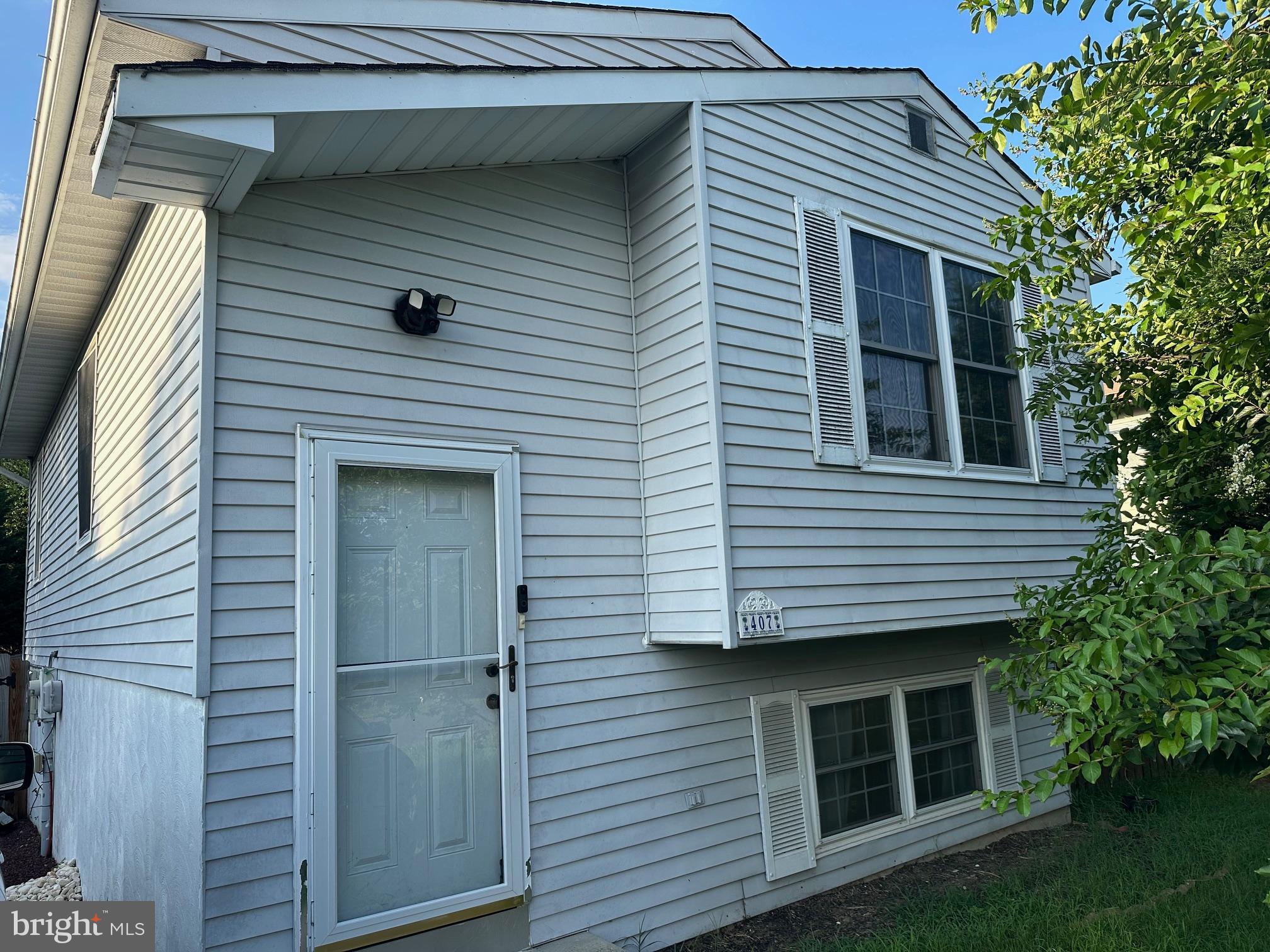 This cute Single Family Residence is located in a quiet non through street in a super convenient location close to Routes 97,100, Fort Meade, BWI Airport, NSA and more. Plenty of off street parking for all your family and friends. Relax and have lunch in the fully fenced large open sun filled rear yard or on the spacious deck. This home features 2.5 fully finished levels. The entry foyer opens to the wood staircase leading to the bright eat in kitchen with pantry and plenty of table space. This level features a full bath with tiled lined floor and tub. The primary bedroom has a ceiling fan and french doors leading to the deck overlooking the gorgeous yard. Lower level family room features easy to care for laminate floors and hookups for internet access. There is a bonus room which would be perfect for home office. Additionally there is an outside entrance to the rear yard for your convenience. Full size washer and dryer located on this level. You can submit your application online at: https://apply.link/taeF8_Q.