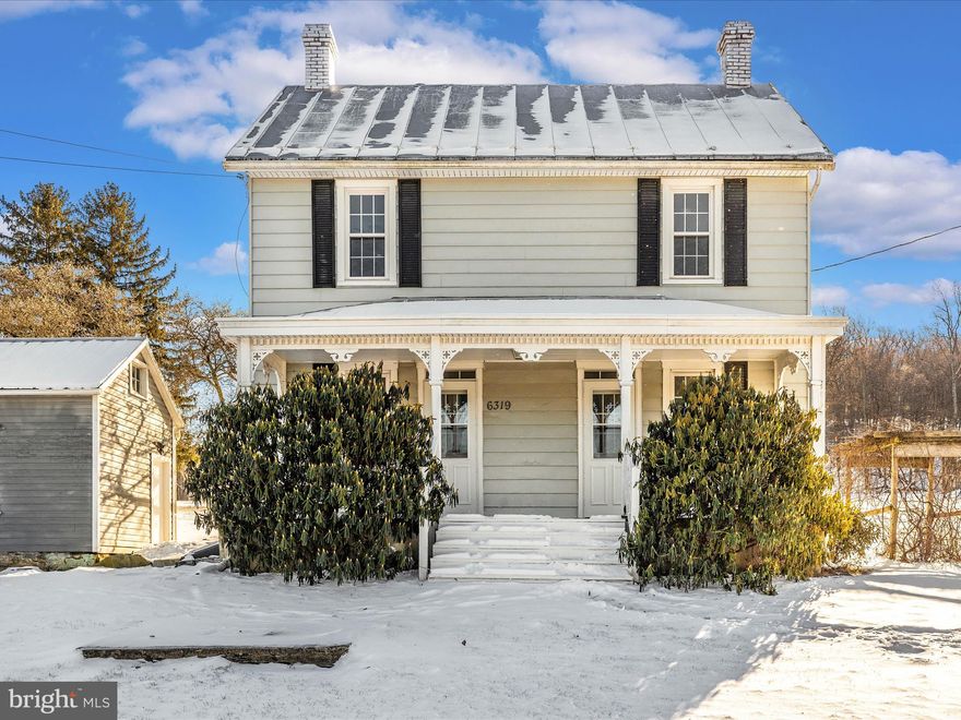 OFFER DEADLINE IS MONDAY, 1/13 AT 4 PM.  If you're searching for an affordable home with plenty of acreage to make your own, look no further! This property offers the perfect opportunity to live off the land, complete with a variety of fruit trees and bushes, including Persimmons, apples, cherries, and blueberries.  Approximately half an acre is already fenced, with another half-acre ready for fencing. Enjoy peaceful moments under the Gazebo while taking in stunning mountain views or unwind at the gravel patio or concrete patio areas. The property features a well-maintained hen house, a meat house, a pig barn with a new floor and wood siding, and a bank barn with three stalls.  Additional outbuildings include a run-in shed, summer kitchen, and detached garage—ideal for extra storage or hobby space.  Inside, you’ll appreciate the charm of hardwood floors throughout the kitchen, living, and dining areas, along with a spacious laundry room featuring a convenient half bath. Upstairs, the full bathroom boasts ceramic tile and a large, tiled shower. The three bedrooms are all generously sized, with gleaming hardwood floors that enhance the home’s warmth and character.  Leave the hustle and bustle of city life behind and embrace the tranquility of country living!