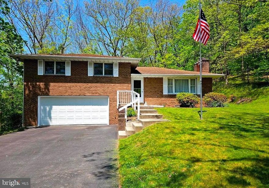 Immaculate Fully Furnished 3 Bedroom, 2 Bath Total Brick Tri-Level Home on ½ Acre Lot situated at the end of the quiet cul-de-sac. Upper floor offers 3 Bedrooms and Full Bath. Open floor plan on main floor with fully equipped kitchen with breakfast bar. Formal dining and spacious living room. Lower-level family/rec room (27 x 24) with brick wall fireplace and full bath. Attach garage with workshop bump-out. Relax on the patio or deck overlooking private fully wooded rear yard. Paved driveway. Desirable neighborhood. Short drive to Cumberland, Frostburg, & Romney. Don’t miss your chance to own this fantastic home!