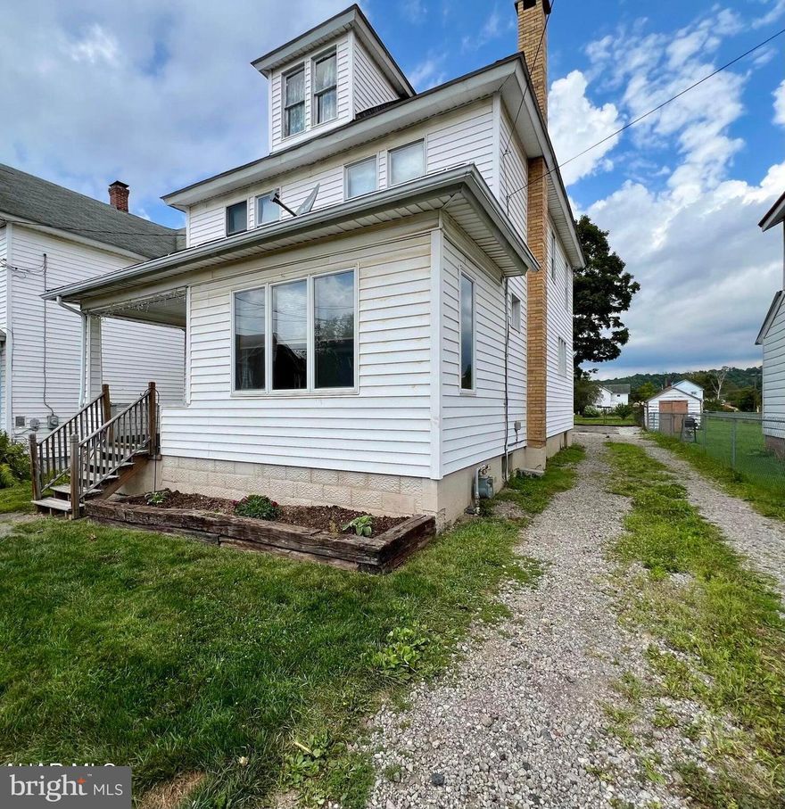 Don't miss out on this incredible opportunity with a MOTIVATED SELLER!  4-bedroom, 1.5-bathroom residence located in the lovely town of Portage. This home features an inviting foyer, stunning hardwood floors, doors, and trim throughout. The spacious living room features a cozy gas fireplace and opens up to additional versatile space that could be used as a playroom, office, or whatever suits your needs. The dining room includes a built-in bar with beautiful stained-glass windows, and the eat-in kitchen is a perfect space for meal preparation. Upstairs, you'll find four bedrooms and a full bath, providing ample room for the whole family. The basement includes a large laundry area and a half bath for added convenience.

Step outside to discover a partially covered deck and a spacious flat yard, perfect for outdoor entertaining or relaxation. Convenient off-street parking is available with access from both the front and rear.