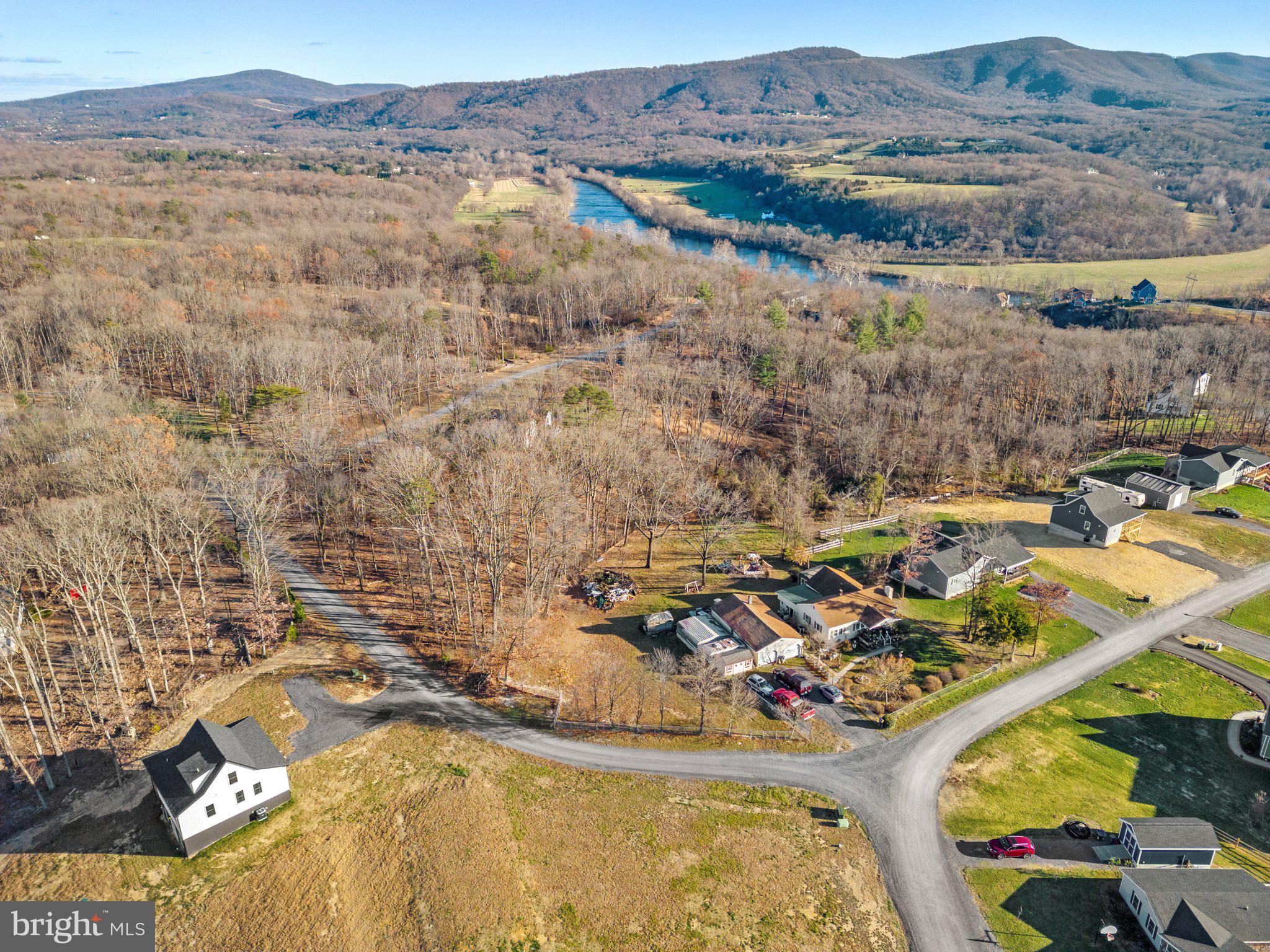 Seller is offering a 2-1 interest rate buydown! Save thousands over the first two years of your loan. Enjoy a significantly reduced rate your first year—making your monthly payments more affordable while you settle in. Ask your lender how this incentive can help you qualify or lower your payment. The riverside retreat you have been dreaming of! Nestled in a picturesque one-acre lot, this brand new cottage offers the perfect balance of privacy and tranquility, while also providing easy access to the many outdoor activities this area has to offer. Just a short drive to downtown Front Royal, you will enjoy the many dining and shopping options this charming town has to offer.
A deeded river lot means outdoor fun is also just steps away. Enjoy an abundance of water activities in the Shenandoah River, such as boating, kayaking, swimming and much more!
The wrap around porch welcomes you inside, where you are greeted by soaring vaulted ceilings, LVP flooring and unique features throughout. The open floor plan is perfect for entertaining friends and family, as is the beautifully designed kitchen. With two-tone cabinets, solid surface countertops and Stainless Steel appliances, you will feel like a chef in your own home!
The split floorplan offers privacy and separation for family members and visitors. All three bedrooms are suites, with their own attached bathrooms and sizeable closets. The walk-out, fully finished lower level is the definition of a blank canvas, ready for your ideas. With a full bathroom and a separate entrance, this space can easily be used as a fourth bedroom, den, office, gym, playroom, etc.
Don't wait, come make this exceptional home your future home, and enjoy all of the natural beauty this area has to offer.