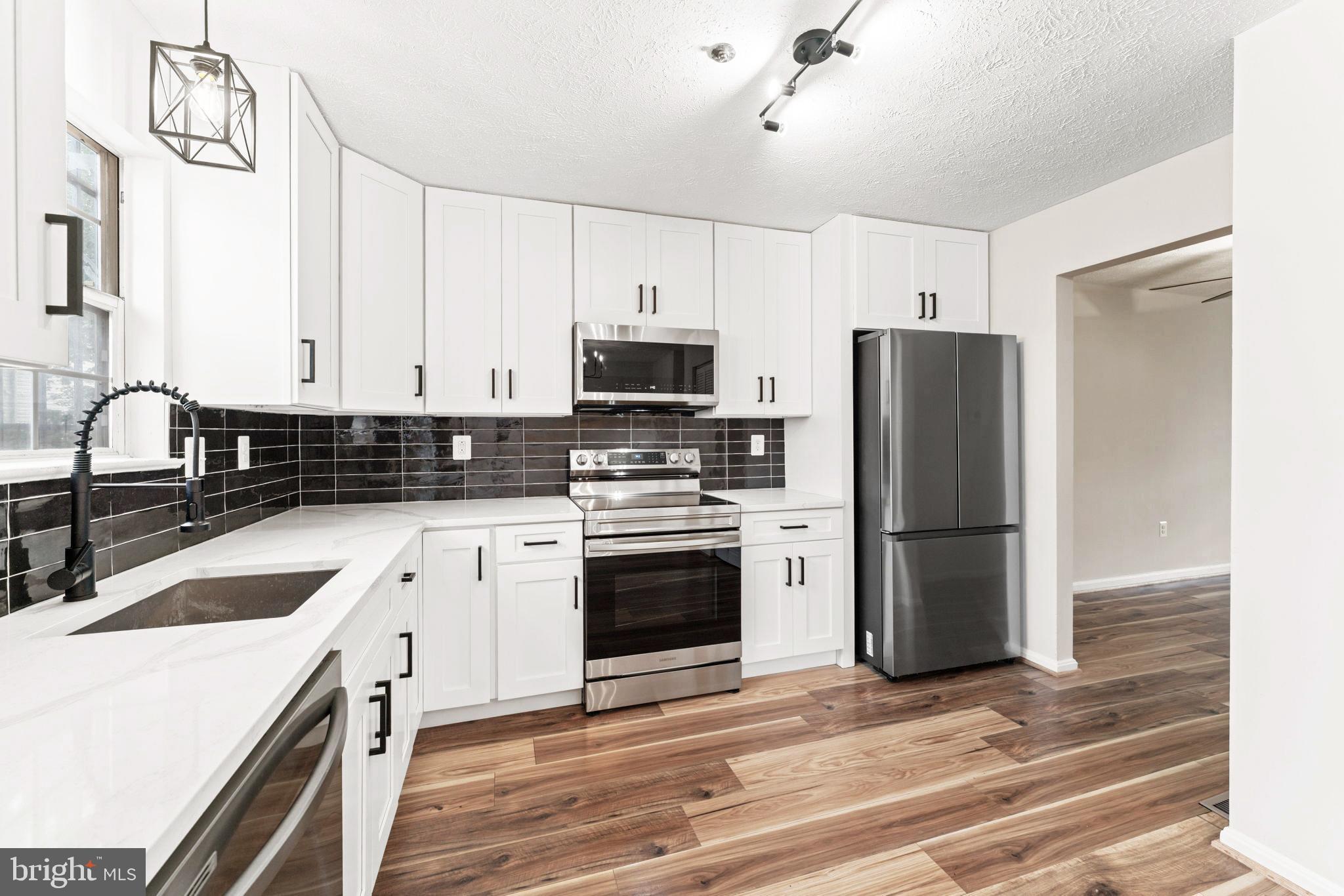 Welcome to this beautifully updated 3-bedroom, 3.5-bath Townhome in the heart of District Heights!
Filled with natural light, this Stunning residence features a modern kitchen with custom shaker cabinetry, Calacatta quartz countertops, a designer tile backsplash, and premium stainless steel appliances. The kitchen opens to a spacious rear deck overlooking a fully fenced, private backyard—perfect for outdoor entertaining.
Enjoy luxurious bathrooms adorned with exquisite tile work and upscale finishes. Throughout the home, fresh designer paint tones and sophisticated fixtures add to the refined atmosphere. The fully finished basement offers a full bathroom and a flexible bonus room ideal for a guest suite, office, or media room.
Located just minutes from shopping, parks, dining, and major commuter routes, this home combines style, comfort, and convenience.
Don’t miss your opportunity—schedule your private tour today!