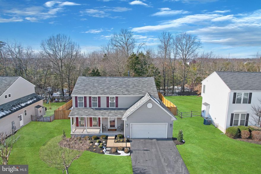 This meticulously maintained Ryan Belvedere Model home backs to trees, offering privacy and serene views. The exterior features a covered front porch, a deck, a sunroom, and a fenced backyard, with the fence installed in 2021. Inside, the open-concept main level provides a seamless flow from the kitchen to the sunroom and family room, complete with a cozy fireplace. The full unfinished basement includes egress for a future bedroom and a rough-in for a bathroom, providing ample potential for customization.

This pet-free, smoke-free home boasts numerous modern upgrades, including an ADT Security System and a fully finished garage equipped with a Tesla Generation 3 Wall Connector at 60 AMP capacity. Major systems have been updated for efficiency and reliability, with a new HVAC system installed in 2020 featuring HEPA filtration and a surgical-room-grade clean air system, along with a new water heater and sump pump, both installed in 2020. The kitchen appliances include a refrigerator and dishwasher purchased in 2015, a washer and dryer purchased in 2022, and a microwave added in 2024. The exterior was freshly painted in 2023, and some interior painting was completed in 2025. This property combines comfort, functionality, and thoughtful updates, making it a rare find. Schedule your showing today to see all it has to offer!