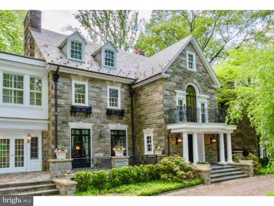 In the heart of Radnor Township sits an elegant, well maintained estate property. Private gated drive w/Belgian block accents, leads to this grand stone mansion w/slate roof and copper gutters.  Cobblestone & a brick apron accent the entrance w/stately columns. The oval brick garden has a gorgeous fountain and charming bronze statuary. Fabulous lush landscaping, with specimen plantings, surround the property. This magnificent home boasts a huge Reception Foyer, stately Formal Rooms,  5 fireplaces, outstanding original custom millwork and gorgeous quarter-sawn hardwood flooring.  The 6 bedrooms are ample sized and each has a private adjoining bath.  The private maid's quarters or au-paire suite has a private entrance.  The detached 5-car garage features a covered breezeway for direct access to the home.  The floored garage upper level, accessed from the turret, offers the potential for additional living space, complete w/electricity and plumbing.  Amid estate fencing, picturesque flagstone patios and walkways, sits a private in-ground pool. There are few estates of this level and quality left. It is in pristine condition, and has been lovingly maintained and updated for today's lifestyle, but with all the original features and millwork, it is truly reminiscent of a by-gone era with unparalleled craftsmanship that could not be duplicated today.