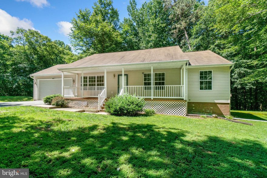 Terrific 3 bedroom, 2 bath rancher with a 2 car attached garage situated in the middle of over 5.4 wooded acres! Enjoy the tranquility of watching the wildlife from the spacious sunroom or exit the slider doors to the back deck for cook-outs and gatherings with family or friends!  New flooring in kitchen, bathrooms, living room hallway and bedrooms!  Spacious, full unfinished basement with a door to the wooded back yard!  Plenty of space for outside storage in the built-in storage area underneath the sunroom.