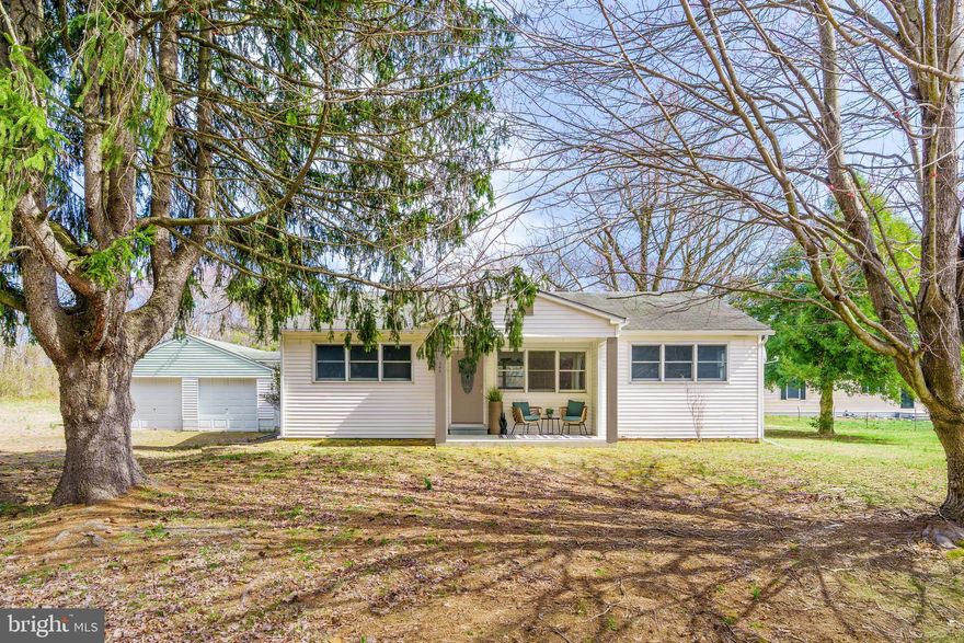 OFFER DEADLINE: March 25, 12pm. There's no place like home! Nestled on nearly half an acre, this charming 3-bedroom, 1-bathroom ranch offers the perfect canvas for your personal touch. With hardwood floors and unique arched doorways, this home exudes character and warmth. The large detached two-car garage is perfect for additional storage or a workshop area, ideal for hobbies and projects. Priced to sell, this property invites you to envision and create your dream home in a serene setting. Don’t miss your chance to make it your own!