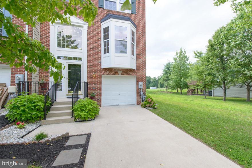 Incredibility spacious &  light filled end of group backing to community open space.  Two story bump out adds extra living space.  Powder rooms on main & lower level.  Fantastic private deck off breakfast room. Two sets of full windows and slider in lower level Family room to include gas fireplace.  Conveniently located with quick access to RT 29 & 70, shopping & restaurants.  Truly move in ready.