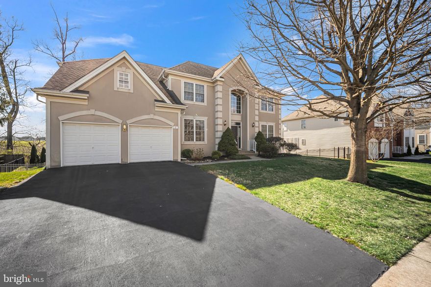 18 Sunflower Way sits on a picturesque lot overlooking preserved green space in the highly desirable Estates at Huntingdon Valley sub-division. This immaculate 5 bedroom, 3 full bathroom Colonial will catch your eye from a mile away. Notice beautifully manicured landscaping, leading up to this gorgeous home. Walk inside to find a towering 2-story foyer glistening with natural light. Formal dining room adorned with custom trimwork and elaborate window treatments on your right.  The Living room is imbued with Doric columns and offers a comfortable meeting and greeting space for guest to your left.  Another notable characteristic of the home is a main level bedroom; truly an ideal living quarters for an au-pair, out-of-town guests or elderly parents. Moving on into the 2-story great room featuring large windows and a gas-burning fireplace. A kitchen sits adjacent to the great room. With 42" wooden cabinets, a large center island, gas cooking and dual wall ovens, you will find most of your time at home being spent here with the family. Off of the kitchen is a pantry, breakfast area and an additional morning room with more large windows. The remainder of the main level holds a full bathroom with a tub shower and a mud/laundry room with interior access to the 2-car garage. Sitting adjacent off of the morning room is an oversized elevated deck.  The offers serene vistas overlooking a backyard preserved green space. Make your way up to the second level to find a landing area open to below over the great room and grand foyer. A well appointed hallway bath and 4 spacious bedrooms make up the second level. Through the French doors lays the primary bedroom featuring tray ceilings, his/her walk-in closets and a owner's bathroom featuring double vanities, soaking tub, shower stall and private water closet.  Already partially finished, the walk-out  basement is a massive area that is essentially an open canvas for whatever space your family envisions; featuring a 9' ceiling and a rough in for a bathroom. Truly idea as a play or entertainment area; perhaps with a fitness room, sauna and cinema. Walk out to your own private backyard boasting a concrete patio.  You will find the backyard is secured by an aluminum fence and rear lined with tall shrubs. One could only imaging the family gathering and BBQs you could host with such an outdoor space. The neighborhood is full of shops and popular restaurants such as La Voglia, Osteria Saporino and Café Ole. Renowned Lower Moreland Schools will leave you with confidence this is that place you will want to call your forever home. Don't miss this gem and schedule a private tour today!