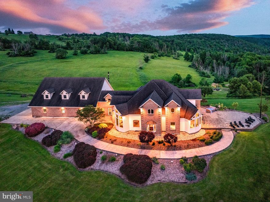 Discover an extraordinary lifestyle with this 11,762 sq ft estate on 50 +/- acres of lush land for your dream residence or an Airbnb investment. Admire breathtaking views from this stunning 5 bed 6 bath home blending luxury with nature. Through expansive windows enjoy panoramic scenery with the serene pond fields and woods that are enriched with abundant wildlife. The main level features a custom kitchen, grand master suite, laundry room, library, and office. The impressive living room with cherry hardwood floors leads to a sweeping staircase, and upstairs hosts two bedroom suites ensuring privacy. The daylight basement offers potential for in-law quarters or a rental apartment with its own kitchen and entrance. Enjoy the efficiency of radiant heating throughout, supplemented by a waste oil burner in the garage, ensuring economic warmth. The "6 car garage" accommodates a pickleball court and game room and is easily reconfigurable. Conveniently located near Tioga County attractions.