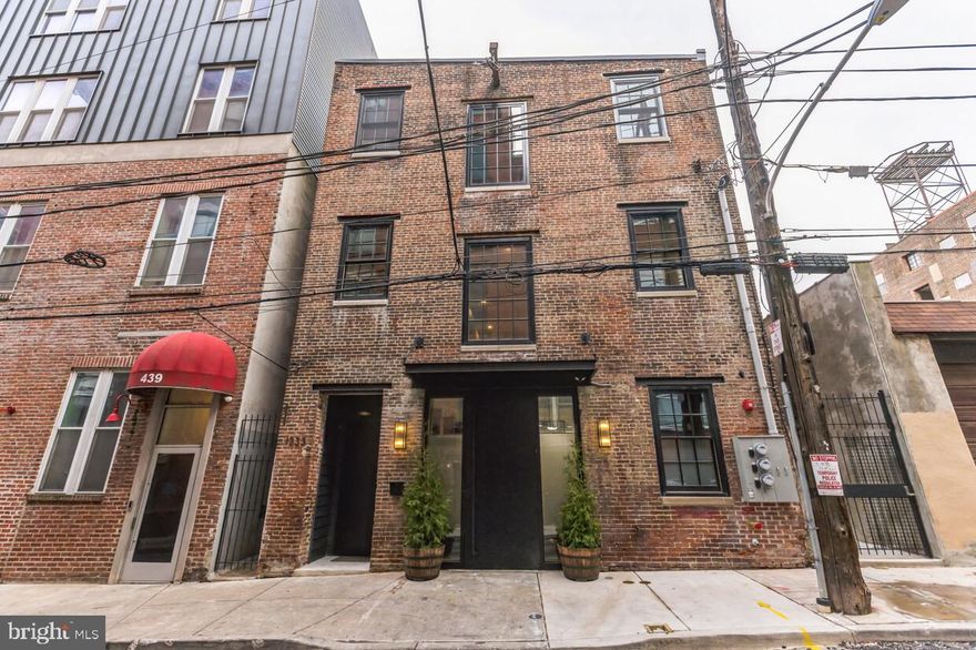 1233 Hamilton Street is a rare opportunity to own a beautifully restored mixed-use property in the vibrant Spring Arts district of Philadelphia. This historic carriage house conversion was completely rebuilt down to the masonry walls and everything is brand new as of 2023, including roof, windows, doors, and all mechanical systems. The result is a modern, turn-key property with the timeless character of its historic origins. This unique three-story building combines two floors of modern office space with a stunning top-floor residential loft, making it the perfect live-work investment or boutique headquarters. SBA financing is also available, offering up to 90% loan-to-value for owner-occupants.

The office space spans an expansive 2,880 square feet across the first and second floors. Designed to inspire both productivity and creativity, the office features exposed brick, abundant natural light, and a sleek modern design throughout. It includes an Italian marble kitchenette and break area, storage space, multiple call rooms, a conference room, and a restroom. Additional conveniences include a smart Latch access system, offering full mobile phone control for seamless entry and security. With its thoughtful layout and premium finishes, this office environment is perfectly suited for a small to medium-sized business looking to thrive in one of Philadelphia’s most connected neighborhoods.

The third floor of the property is home to a beautiful two-bedroom loft that blends industrial character with modern sophistication. The open-concept living space boasts vaulted exposed timber ceilings, custom Anderson windows, exposed brick walls, and abundant natural light. The designer kitchen features matte black cabinetry, stainless steel appliance package, and an oversized island with natural stone counters and backsplash, creating an ideal space for cooking, entertaining, or simply enjoying a meal at home. The living room is spacious and airy, accented by exposed ductwork that enhances the industrial aesthetic. Additional conveniences include a smart Latch access system, offering full mobile phone control for seamless entry and security. The space is currently rented and achieves $2,550/month in rent, providing immediate cash flow potential.

For commuters, the property is centrally located just off of I-676, only two blocks from the Broad Street Line, and within a 15-minute walk to SEPTA Regional Rail stations at Jefferson and Suburban. The Spring Arts location also offers unmatched access to the best of city living, with popular restaurants, breweries, gyms, concert venues, and the newly built Rail Park all within walking distance. Everyday conveniences, including a brand-new full-sized Giant grocery store, are just steps away, alongside neighborhood favorites such as La Chinesca, Café Lift, Yards Brewery, Love City Brewery, and Reading Terminal Market.

Whether you are an investor seeking a mixed-use property with built-in rental potential or a business owner ready to establish a headquarters with a private residence above, 1233 Hamilton Street delivers the best of both worlds: premium office space and stylish city living under one roof.

-Historic Carriage House Conversion in Spring Arts | Two floors of office space and a top-floor residential loft
-SBA Financing Available | Up to 90% LTV for Owner Occupants
-Expansive 2,880 SF Offie Space | Stylish Two-Bedroom Loft 
-Excellent Transportation Access | Located just off I-676, only two blocks from the Broad Street Line, and within a 15-minute walk to Jefferson Station
-Spring Arts Neighborhood Amenities | Surrounded by restaurants, breweries, gyms, concert venues, the Rail Park, and a full-sized Giant grocery
-Ideal for Investor and/or Owner User | Perfect for investors or business owners seeking premium office space combined with residential income