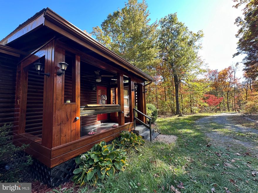 **Charming Log Cabin Retreat on Over 4 Acres of Nature's Paradise**
Welcome to your dream log cabin nestled in a serene, private wooded area. Built in 2005 and meticulously maintained, this enchanting property offers peace and tranquility on an expansive 4.07-acre lot.
This log cabin home features 1,080 square feet of comfortable living space with 2 cozy bedrooms and  1 well-appointed bathroom.  Delight in a fully updated kitchen with brand-new appliances, perfect for culinary adventures. Stay cozy as the owner recently had a  new heat pump system installed in 2024.
Step outside onto your inviting deck, complete with a relaxing hot tub, the ideal spot for unwinding in nature and embrace the captivating sights and sounds of the local wildlife that is frequent in the area. Outside your backyard you can explore your own private walking path leading to a thoughtfully cleared camping site, perfect for stargazing and enjoying peaceful nights under the stars.
This log cabin offers the perfect blend of rustic charm and modern comforts, making it an idyllic retreat for nature lovers and those seeking a peaceful sanctuary. Don't miss this unique opportunity to own a piece of woodland paradise. Selling as-is.