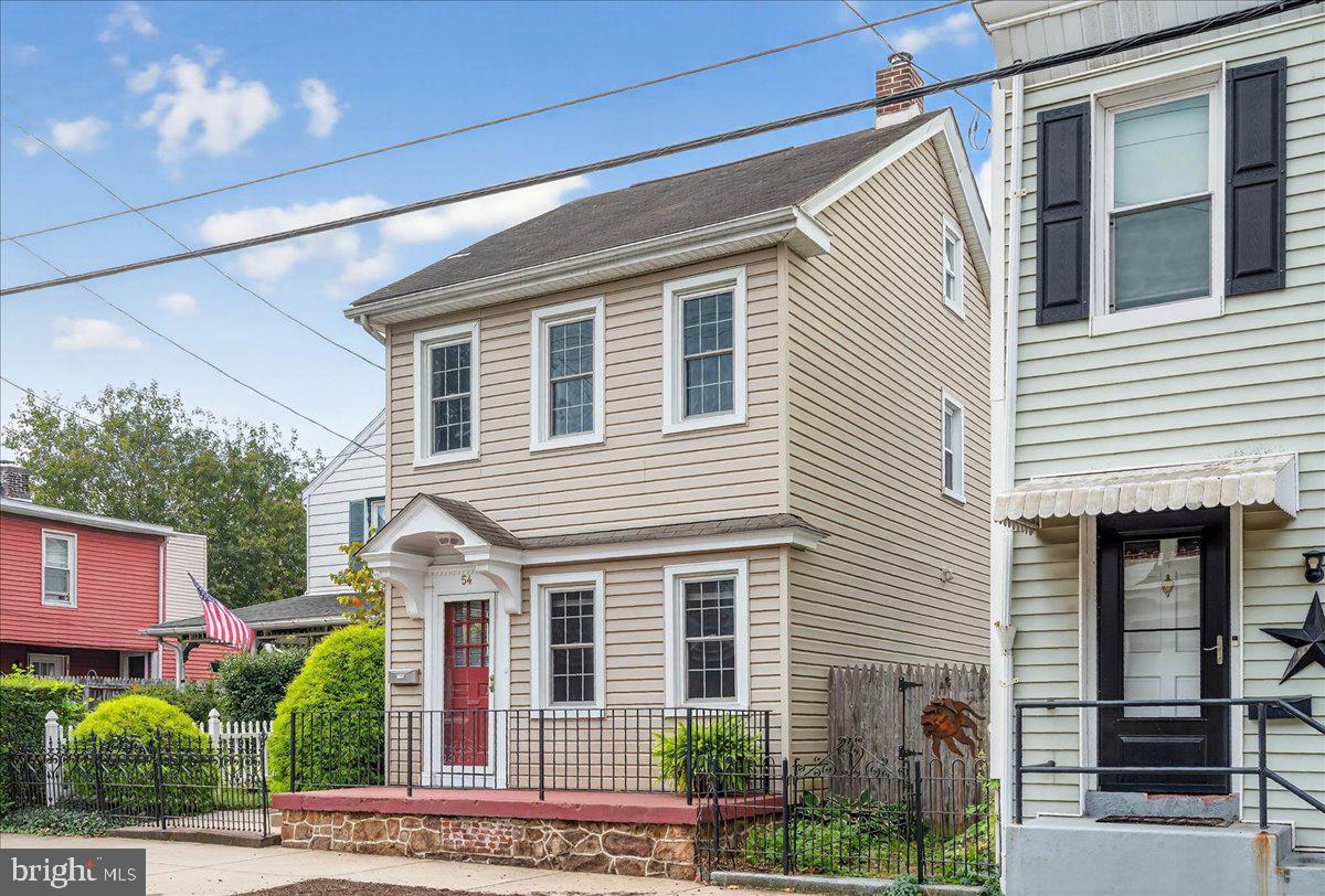 Welcome home to 54 Chestnut Street! This quaint detached colonial has 3 bedrooms, 1.5 bathrooms, 1,426 sq ft, has been lovingly maintained and is move-in ready. You’ll be struck by just how many windows this home has throughout, flooding every room with glorious natural light! As you step onto the front porch and through the door, you’ll notice the original hard wood floors. To your right is a convenient powder room. Down to the left is a small dining room or sitting room. Further back is your eat-in kitchen with luxury vinal plank flooring, subway tile backsplash, double-sink, gas range, and a breakfast bar. On the second floor you’ll find a large primary bedroom and one other bedroom. There is a 3rd flex room/office that has the convenient 2nd floor laundry which leads into the well-appointed full hall bath with tile floor and two linen closets. Up in the third-floor is the 3rd bedroom. The meticulously landscaped backyard is truly an oasis, with a covered porch that flows out to a back deck with canopy. What a great place for grilling and entertaining with friends and family or just having a glass of wine after a long day. The whole yard is fenced in, which is great for the pets and kiddos. Further back there’s a well-maintained shed, equipped with a large movie screen right on the front, which can be electrically unfurled for outdoor family movie night! Finally, there are three private parking spaces out back, which make living here so convenient. This location is within walking distance to all the local shopping, restaurants, brew pubs, Schuylkill river trail, and River front park and Manatawny Green Mini Golf. Major Routes 422 and 100 are just a few minutes’ drive away and can get you anywhere in the area you want to go in no time. Come see this beautiful home before it is gone!