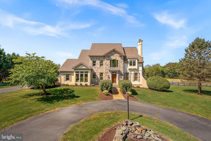 **OFFER DEADLINE- October 13, 2025 at 5 PM**  Welcome to the perfect blend of privacy, charm, and modern convenience in this custom-built residence, nestled on over 10 serene acres with breathtaking sunset views right from your back deck.  This rare offering in one of Western Loudoun's idyllic settings will allow you to enjoy quiet evenings on the back deck, summer days by the pool or family gatherings in the sprawling backyard set against the perfect backdrop of rolling fields, mature trees and the mountain ridge.  Spanning over 5,000 square feet spread out over 3 levels, this elegant home offers four spacious bedrooms, five full bathrooms, a two-car garage, an inground pool, and a fenced backyard—with no HOA giving you true freedom and endless possibilities.  
From the moment you arrive, you’ll be captivated by the manicured landscaping, stone and stucco-front exterior, and the circular driveway. Step inside to a light-filled two-story foyer, freshly painted in designer neutrals from top to bottom, with hardwood floors and premium mouldings and trim work throughout that highlight the home’s architectural charm.  Designed for both everyday living and entertaining, the home provides dedicated spaces for work, relaxation, and gathering. A private office ensures productivity, while the formal living with a beautiful marble surround fireplace and dining room create a sophisticated backdrop for hosting. At the heart of the home is the remodeled gourmet kitchen —featuring timeless cabinetry, premium counters, double wall ovens, and a brand-new gas cooktop. The adjoining family room, anchored by a stunning stone fireplace, custom built-ins and bathed in natural light, with large windows that look out onto a custom deck overlooking your backyard oasis—perfect for grilling, family fun, or quiet evenings surrounded by nature.  A full bathroom round out the main floor.
Upstairs, the luxurious primary suite boasts a spacious sitting room with a wall of windows, a dressing area, and abundant closet space. The spa-inspired bath includes dual vanities, an expansive glass-enclosed shower, and a soaking tub for the ultimate retreat. Three additional bedrooms offer en-suite or adjoining baths, plus a bonus room that can serve as a second office, playroom, or guest space.
The fully finished lower level expands your options for relaxation and entertainment, complete with a bonus 6th room and full bath with a built in sauna shower to create your own spa retreat.
This property offers the perfect blend of peaceful country living and everyday amenities. With ample space to welcome horses and chickens, it embraces a true countryside lifestyle—while being just moments from downtown Purcellville and Leesburg’s vibrant dining, shopping, and historic charm. Outdoor enthusiasts will appreciate the nearby scenic trails, golf courses, and Virginia’s renowned wineries and breweries. Don’t miss this rare opportunity to own a beautiful home in one of Purcellville’s most desirable locations.
