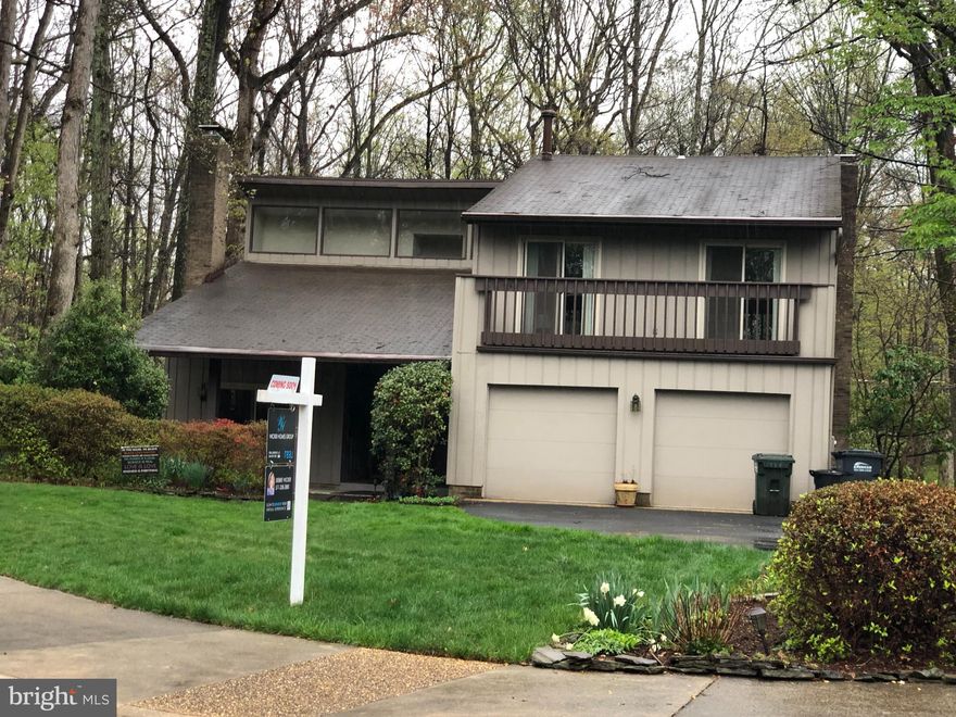 Single family home in prime Reston location on a quiet circle, backing up to wooded privacy!!  Professional photos to follow shortly.  Opportunity knocks here for anyone seeking a great home at a great price, prior to doing a few cosmetic updates.  Home is over 2,900 finished S.F. on two living levels, with a 2 car garage, on a quiet circle in North Reston. The kitchen was renovated in 2012, and the home has two fireplaces (one is from the floor to top of the 2 story vaulted ceiling). It also has several beautiful updates such as a tiled patio overlooking a koi pond, and a magnificent custom mahogany front door!! Terrific single family home opportunity in great Reston location!!