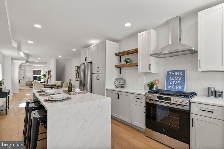 Welcome to 1523 Clarkson Street.  This stunning and complete renovation has everything you are looking for in a Federal Hill home. Boasting 3 bedrooms, 3 full baths, roof top deck and easy parking on your private pad.*SAVE THOUSANDS* WITH THE APPROVED CHAP TAX CREDIT PROGRAM . Interior features include hardwood floors, large designer kitchen with a waterfall countertop and upgraded appliances, custom tile work, upgrade fixtures and much more!
As you enter this home you will immediately be immersed in tons of natural light and a warm palette of colors, including the hardwood floors and kitchen island base cabinetry. 
The basement is ideal for additional living space, office, or the third bedroom with its full bath and egress to  the front of the home.
Ascending to the bedroom level you will find two additional bedrooms and baths. The large en suite primary bedroom boasting a very large closet and a spa like custom bath with high end fixtures and custom tile work. Working your way down the hallway, illuminated with custom recessed lighting, you will find the third full bath adorned with beautiful tile work. A large laundry center with full size washer/dryer and shelving for storage. At the front of the home you find the large third bedroom. Make your way up  the interior stairway to the expansive rooftop deck that has stunning views of the city and of your large and easily accessed private parking pad.