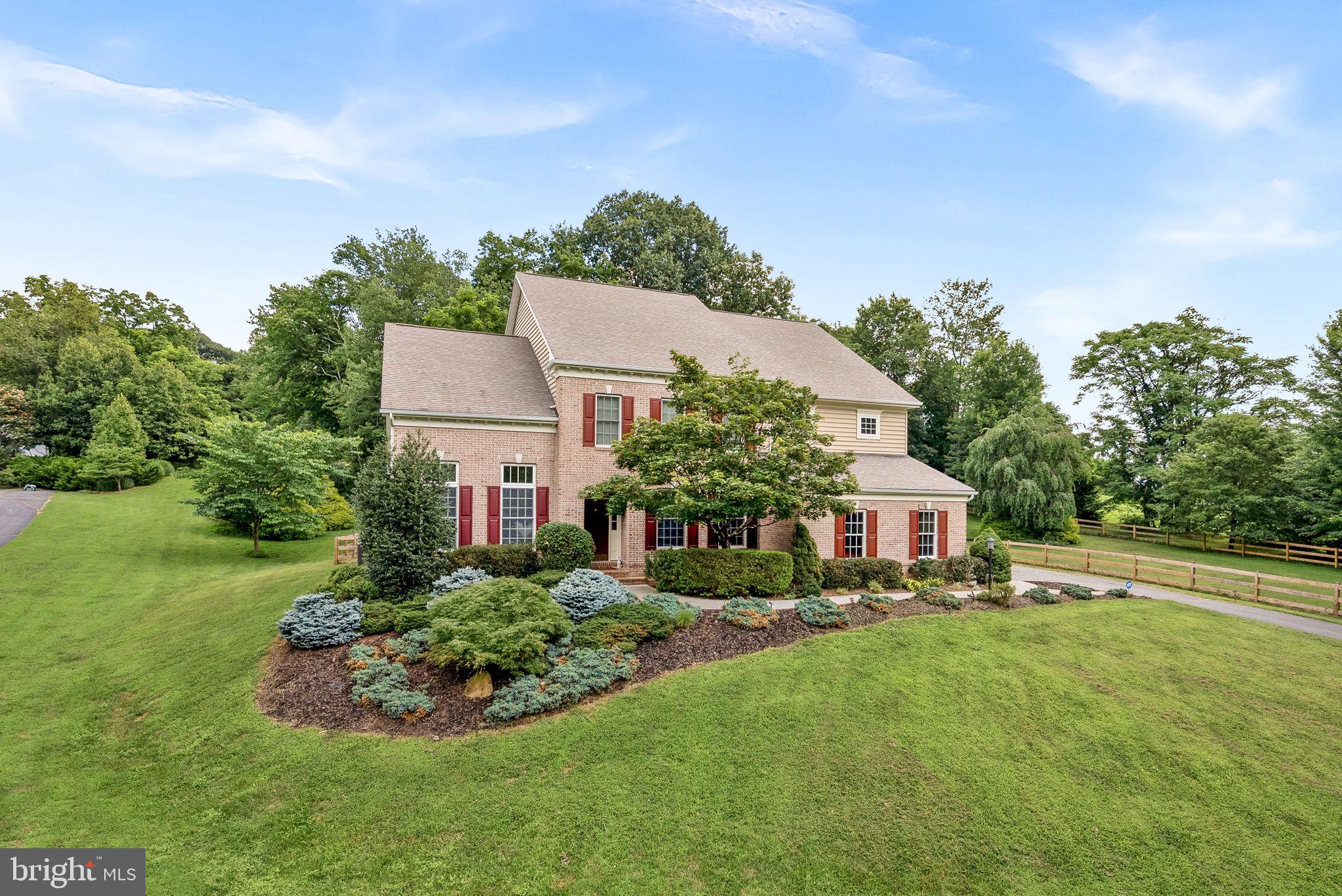 Welcome to Your Private Paradise in Round Hill! Just imagine the birds chirping, rustling leaves and peace.
Tucked away at the end of a quiet cul-de-sac on nearly 4 acres, this exceptional estate offers the perfect blend of privacy, space, and convenience. Facing to over 40 acres of wooded HOA land, this property delivers the tranquility of country living with easy access to nearby Round Hill, Purcellville, scenic hiking trails, and Loudoun County’s top wineries and restaurants, shops and attractions.
Boasting over 7,200 ttl sq ft, this home is thoughtfully designed for both everyday comfort and effortless entertaining. Soaring ceilings and a dramatic two-story living room create a grand first impression, while the updated lighting and hardware add a fresh, modern touch. The spacious kitchen opens to a cozy family room with a fireplace—ideal for relaxed gatherings. Multiple living areas, a dedicated home office, and a newly finished basement (completed in July 2025) with a full bath and wet bar prepped to provide versatile options for work, play, and hosting guests.
The upper level features four spacious ensuite bedrooms, offering ultimate comfort and privacy for all. Outside, enjoy landscaped grounds, a fenced one-acre area, patio, and a fire pit—your own retreat for entertaining or quiet evenings under the stars.
**Assumable VA loan at 4.75% (for eligible buyers)**
Experience the very best of Loudoun County living in this one-of-a-kind property—where you can design to elevate your lifestyle.
