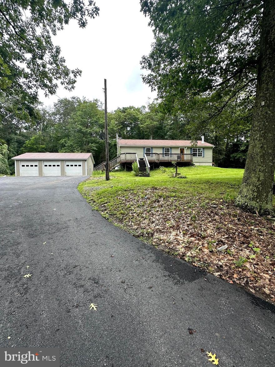 Enjoy life on the mountain! This spacious home has 3 bedrooms and 2 full bathrooms on the main level.  The basement offers approximately 1000 sq ft that could be finished into more bedrooms and bathrooms. Newer Heat Pump with propane backup and Tankless hot water heater. Home provides an oversized detached garage with workshop. close to major routes and close proximity to State College.