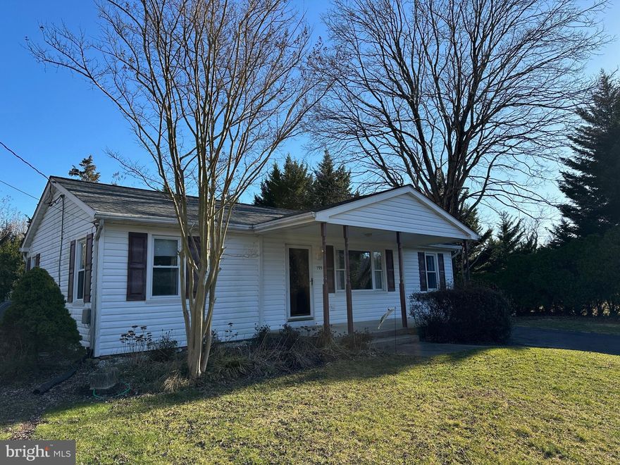 $20,000 Price improvement!!! Discover this well maintained ranch-style home, cherished by its original owners. Gleaming hardwood flooring welcomes you into a space filled with warmth and character. The architectural grade roof, vinyl insulated windows, and siding ensure both durability and efficiency. The main level, currently configured for large living room/sitting area, offers the potential for conversion back to three bedrooms. A thoughtful design allows for versatile living arrangements to suit your needs.  Step outside to a world of tranquility. Enjoy a cup of coffee on the inviting covered front porch or entertain guests on the spacious wood deck overlooking a stunning private backyard. A convenient shed/workshop adds functionality to the outdoor space. Unfinished basement could be converted to living space. Prime Location Nestled on a quiet dead-end street, this home provides a peaceful retreat while remaining close to amenities. Easy access to Annapolis, Rt. 97, Ft. Meade, and more makes this location both convenient and desirable.