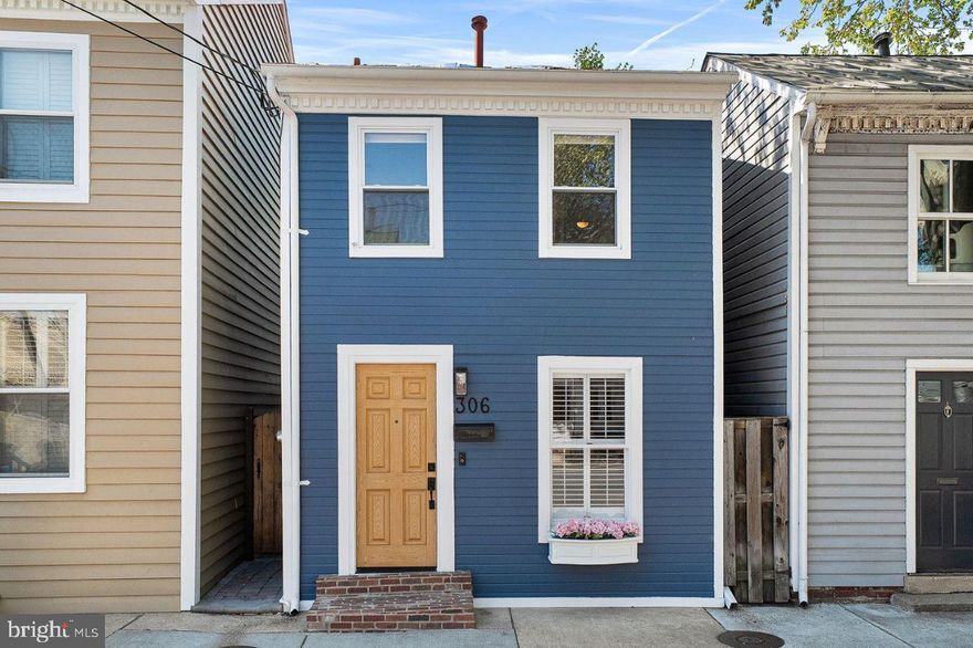 Just 2.5 blocks from the heart of King Street, this rare fully detached home offers the perfect blend of historic charm and modern updates in one of the most walkable locations in Old Town Alexandria. Nestled on a picturesque block, you’ll enjoy easy access to beloved neighborhood restaurants, coffee shops, and boutiques just moments from your door. Inside, the home features THREE bedrooms and one and a half baths, with an exceptionally wide footprint rarely found in Old Town residences, creating a bright and comfortable floor plan. Beautiful teak wood floors run through living and dining rooms. The stunning kitchen renovation (2022) combines timeless design with modern functionality, featuring elegant quartz countertops, classic gray cabinetry, GE Café appliances, a stylish backsplash, and heated tile flooring—creating a warm and sophisticated space for everyday living and entertaining.  A renovated powder room, remodeled custom laundry closet with full size washer and dryer and a coat closet complete the main level.  At the rear of the home, an expansive private patio provides a true outdoor oasis. Recently enhanced with new stone pavers, a freshly painted pergola with string bistro lighting, and a new privacy fence, the space offers the perfect setting for al fresco dining, entertaining, or simply relaxing in a serene environment. Convenient gated side alley access for bikes, trash cans etc. The upper level showcases original hardwood floors throughout all three bedrooms. One bedroom is highlighted by a vaulted ceiling with beautiful exposed wood beams, adding character and architectural interest. A pull-down attic provides convenient additional storage. Many notable updates since 2021 include: New hot water heater (2026); Full kitchen renovation to include adding heated floor (2022); Full powder room renovation (2021); Laundry cabinet remodel with new washer/dryer (2022); Full outdoor patio remodel with new pavers, painted pergola and new fence (2025); New front door (2022); New exterior siding (75% is new) and brick front stoop (2025); New interior (2022) and exterior (2025) light fixtures; New main level shutters (2021). Easy street parking!! Just 0.6 miles to BOTH King St Metro and Braddock Rd Metro making for easy commuting into DC. Stroll the to Potomac River or GW Bike trail. Incredible one-of-a-kind opportunity in Old Town!!