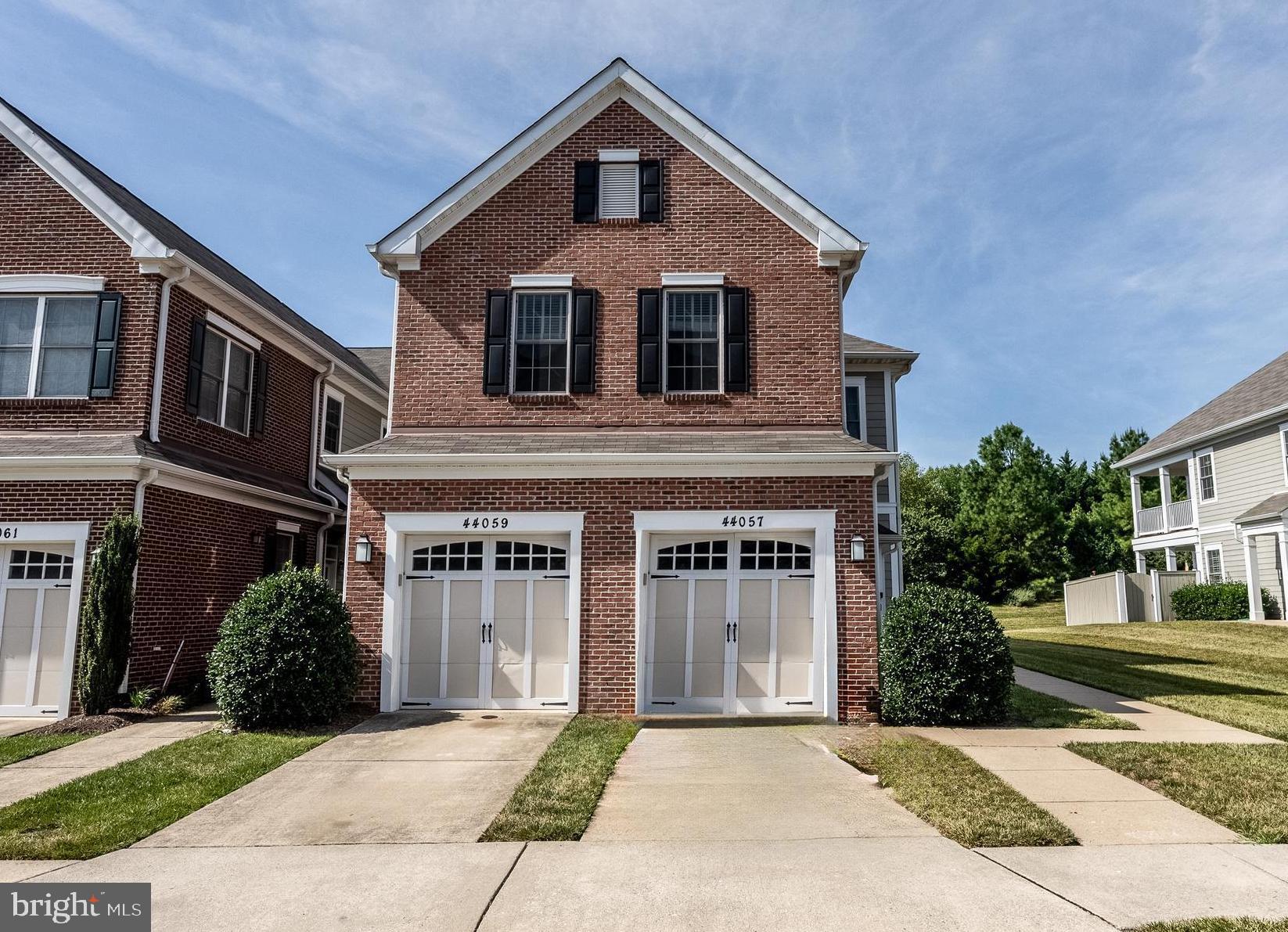 Welcome to this beautifully appointed one-level villa in the sought-after East Gate community of Loudoun County, where style meets comfort and convenience. From the moment you step inside, you are welcomed by hardwood floors that flow through the foyer, hallway, and the spacious main living areas. Crown molding and a ceiling fan add an elegant touch to the living room, while the adjacent dining area sparkles beneath a striking chandelier—perfect for hosting friends and family or enjoying quiet evenings at home. The heart of the home is the thoughtfully designed kitchen, which features granite countertops, stainless steel appliances, recessed lighting, and a central island with seating that invites conversation over morning coffee or evening wine. Just off the kitchen, a private patio opens to a fully fenced rear yard—an ideal space for outdoor dining or quiet relaxation. The primary suite is a retreat of its own with plush carpeting, ceiling fan, two closets (including a walk-in), and a large ensuite bathroom complete with dual vanities, a soaking tub, and a separate walk-in shower. The second bedroom and full hall bath offer comfort and flexibility for guests, while the carpeted third bedroom/den—featuring double doors and its own closet—makes a perfect office, craft space, or guest overflow. Also in the unit is a laundry room with full- sized washer and dryer and more storage! A one-car garage and lush landscaping complete the picture of effortless living. Located within a vibrant community, East Gate offers exceptional amenities including an outdoor pool, walking trails, tot lots, open green spaces, basketball courts, and a welcoming clubhouse. Whether you are looking for low-maintenance living, easy access to shopping and commuter routes, or a beautiful place to call home, this East Gate gem delivers. Welcome home!