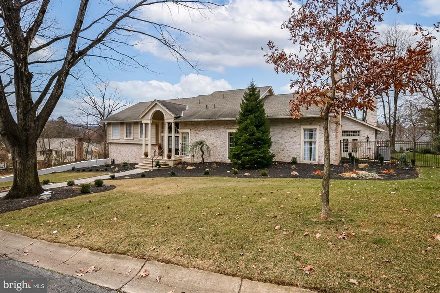 Stunning is the word for this beautiful 5 bedroom home in the heart of the Wyomissing School District.  The caliber of workmanship and the tasteful decor is obvious throughout and classically understated.

Every room is picture perfect as though it were being photographed for an upscale Real Estate magazine.  Everything is where it belongs; nothing is overdone; all is in order. 

 From the open beamed ceilings in the living and family rooms with their fireplaces elegantly gracing these areas to the unique setting for the dining room with its corner full length windows you'll definitely feel at home and comfortable.

 The kitchen is simply magnificent with two large Quartz prep islands surrounded by the custom designed white cabinetry, exquisite lighting fixtures, a Wolf commercial style 9 burner range with double oven.  There is a SubZero built in freezer and refrigerator perfectly hidden within the layout of the kitchen and a coffee station and a huge pantry with all the shelving and cabinet space you could desire plus a dumbwaiter! The porcelain country style prep sink completes the  perfect working triangle of any well designed kitchen.  

The most attractive of counter tops are a match made in "kitchen heaven" complimenting every portion of the kitchen.  There is a snack station with stools next to a beautiful breakfast area with its tremendous view of the patio area through full length windows while providing a feeling of openness with the wooden lined wainscot style cathedral ceiling.  Also on this level is a "flex room" which could be a child's game room, office, reading room or a library plus there is an adjacent full bath.  With over 8,000 sqft every room just feels comfortable and cozy...not huge and overdone.  

Upstairs you have actually two levels; the first is the spacious Primary suite featuring a huge walk-in closet, a well appointed bath area with custom vanities and old style sink fixtures; a 2 person sauna next to a 2 person tiled walk-in shower.  And there's also another walk-in closet.  From the bedroom there is a spacious roof deck just steps though the French doors overlooking the pool and patio areas.  You need to experience this setting during the early evening hours of a gorgeous orange/red sunset!  

Outside the suite area is another bedroom which could be a large office or lounging area.  Up a few steps are two large bedrooms; 2 full bathrooms, a laundry room and a more private 5th bedroom/suite with its own walk-in closet and full bath..

The lower level features a large recreation room with full wet bar and stone fireplace; a fully finished exercise area which opens to the sellers art studio.  There is a door from the art studio leading to a 4 car garage area with epoxy flooring. 

Outdoors there is an irrigation system, a stone patio leading to a spa and inground cement, heated, Salt Water fenced in pool.  

This description can't truly describe everything this home has to offer.  You must visit and take in every nuance of 1504 Old Mill Rd on your own..don't miss the opportunity to see it all.  Call now for your private showing!