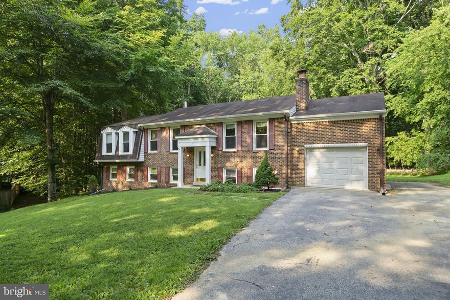 Location Location Location!!! Plenty of room to spread out in this spacious brick front beauty. Upstairs you will find the perfect layout for entertaining....kitchen with plenty of counter space, dining room, and living room. Continue down the hall to the 3 bedrooms and 2 full bathrooms. The main level has hardwood throughout. Downstairs you will find a large rec room with a fireplace....perfect for those colder winter months. There are also 2 additional bedrooms downstairs, another full bathroom, and the laundry/utility room (can be used as a storage room too!). Finish out the summer hanging out on the back deck overlooking amazing backyard, or walk down the steps to the concrete patio. This one won't last...schedule a showing today!