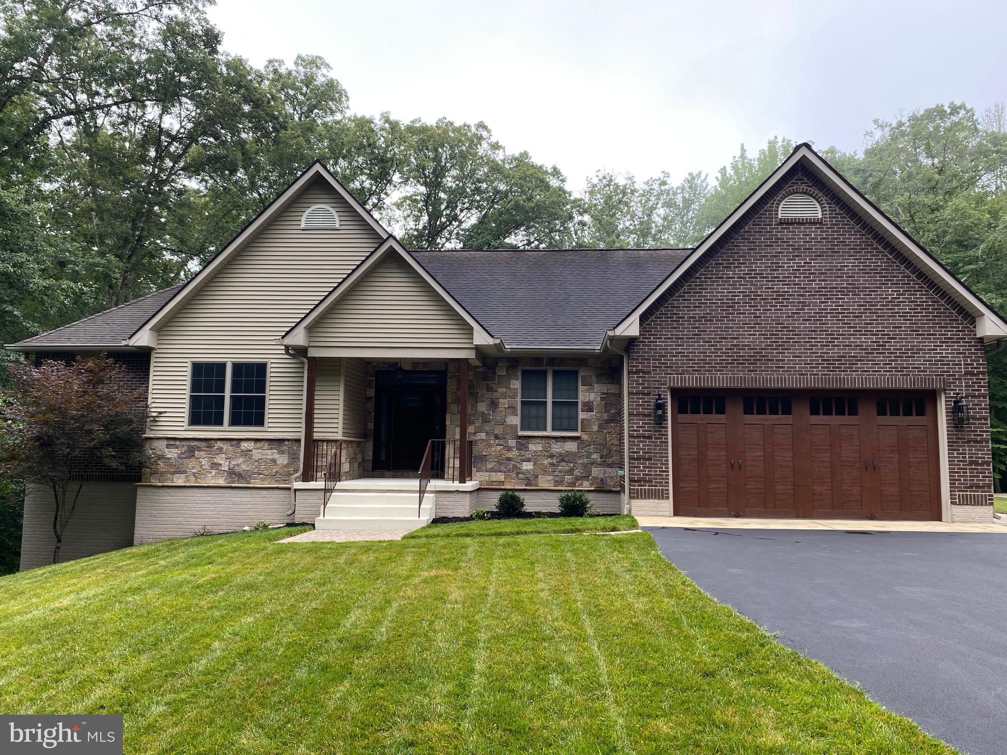 Discover the perfect blend of comfort and style in this beautifully updated 4-bedroom, 3-full-bath rambler set on a serene 1-acre lot. Inside, you’ll find sunlit open spaces, a sleek modern kitchen with stainless steel appliances, and thoughtfully designed finishes throughout. A convenient main-level laundry/mudroom greets you as you enter from the two-car garage—perfect for everyday ease and organization. Step outside to a spacious Trex deck overlooking your private backyard—ideal for relaxing evenings or weekend gatherings. With room to breathe and space to live, this home offers the lifestyle you’ve been looking for. Don't miss out on this beautiful home. Schedule your showing today!