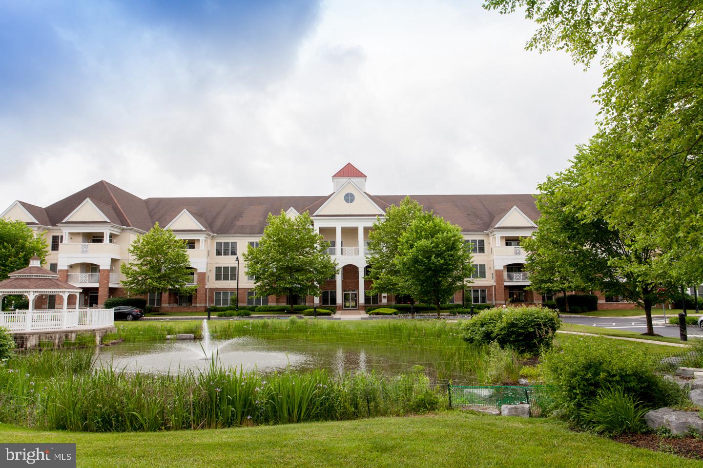 Exceptional opportunity to lease in Meridian of Valley Square, where you can lead a luxurious, active and secure lifestyle in a premier 55+ resort community in Bucks County. This stunning 2 bedroom, 2 bath, second-floor condo features an extra room with French doors for your office or den. The gourmet kitchen boasts high-end stainless steel appliances, travertine floor, a custom-designed mosaic backsplash, custom cabinetry, gorgeous granite countertops and the custom island with granite and seating for 2. The comfortable, open concept floor plan features rich hardwood floors throughout the living area and office, warm designer paint colors, and a corner fireplace to keep things cozy. Access the large private balcony through sliders and enjoy the views. The huge master suite has everything you need--sitting area, tons of closet space, carpeting, and a master bath with soaking tub, stall shower with seat, and vanity with double sinks. The second bedroom is large and bright and adjacent to the second full bath and the laundry closet. Included is an oversized, one car garage with an extra refrigerator and additional shelving. The community offers many amenities including secure entrances, amazing private storage spaces, walking and jogging trails, large outdoor pool, and a clubhouse with billiard room, fitness center, library, and more. Walking distance to Wegman's Food Market and the shops and restaurants at Valley Square. Easy access to major commuting routes. Earliest availability is September 1. At least one tenant must be 55 or older. Non-smokers apply. No pets please. Condo is also available for sale (MLS# PABU529140).