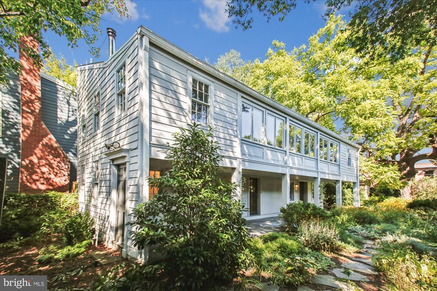 This unique property offers a hidden retreat just 2.5 blocks from the vibrant shops and restaurants of King Street, providing remarkable seclusion and serenity.

This one-of-a-kind estate is situated on two professionally landscaped lots, tucked behind a tall privacy fence. At its core is one of Alexandria’s few remaining detached "flounder" houses, showcasing architectural character and abundant natural light. The home seamlessly blends historic charm with modern luxury, surrounded by beautiful gardens, a 50-foot flagstone porch, and shaded by a large black walnut tree that extends over the garden.

Inside, you'll find reclaimed barnwood floors and sun-drenched rooms that flow effortlessly. The stunning chef’s kitchen is equipped with a commercial-grade refrigerator, Thermador dual-fuel range, Miele dishwasher, and artisan cabinetry. French doors open to a garden paradise, alive with birds and butterflies. From the kitchen, an elegant foyer leads to a welcoming living room featuring reclaimed barnwood floors and a charming wood stove, perfect for relaxing evenings or intimate gatherings.

Upstairs, a spacious and tranquil primary suite offers garden views, a large closet, and a spa-like bath with a soaking tub and separate glass shower. Two additional versatile rooms provide flexibility for use as bedrooms, media rooms, fitness areas, hobbies, or a dedicated home office ideal for remote work.

Outdoors, you can enjoy a custom riverstone fire pit with quarry-stone seating, a discreet garden gym, and a gated stone parking pad for two vehicles. This is truly perfect for town living!

This home is more than just a place to live; it offers a distinct lifestyle. This unique, private sanctuary provides the best of both worlds: complete tranquility just moments from the energy of Old Town.