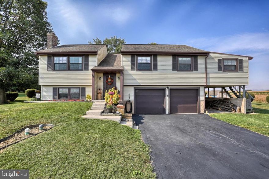 Well-kept 3 bedroom bi-level in Penn Manor with beautiful views. Eat-in kitchen, cathedral ceilings, new oak stairs and railing, finished lower level with fireplace and outside entrance.  Screened in porch, patio, spacious backyard, 2 car garage and shed.