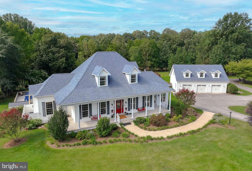 Beautiful farm on over 10 acres complete with a gorgeous 5 bed 4.5 bath country house with wrap-around front porch, detached oversized 3 car garage, and 4 stall center aisle horse barn with tack room. An additional 30x40 drive-through pole barn/workshop, 3 pastures with water, a pond stocked with bass & blue gill as well as perennials and ornamental shrubs designed for year around color round out this dream property. Savor your privacy and breathtaking pastoral views from your three season porch or swim on balmy summer days in your in ground pool, complete with pump house. This home boasts a spacious main level primary suite with sitting area,  2 walk-in closets, private access to side porch or deck and ensuite with 2 vanities, double shower,  jetted tub and cabinets for storage. The kitchen has granite and stainless steel countertops plus 19 foot long granite bar that makes it perfect for hosting and is open to family room with fireplace and breakfast area with big windows and French doors. Additional features included are a dual sided gas fireplace between the  sunroom and living room, central vacuum,  wired connection for your backup generator, fire suppression sprinkler system, 1600 sq ft finished walk out basement downstairs complete with bedroom, full bath and kitchenette - perfect for in-law suite, and so much more. This home has oak hardwood flooring in the living room, dining room and primary bedroom. Ceramic tile floors are found in the sunroom, primary bathroom, powder room, kitchenette, downstairs bathroom and hall leading from patio/pool area. There is new carpeting in upstairs bedrooms, guest room and downstairs office/ craft room. LVP recently installed in kitchen, upstairs bathrooms and downstairs media/exercise room. Enjoy camping or hosting family or friends who do? RV connections are available at the house or barn. Horse owners will love having Oak Ridge park 3 miles away, Maxwell Hall horse park only 8 miles away, and their own fields for growing hay. Work remotely from your bright 12 x 30 office over garage with custom made yellow pine flooring & dedicated HVAC OR commute to DC, local hospitals, Pax River, Andrews or Dahlgren. A must see!