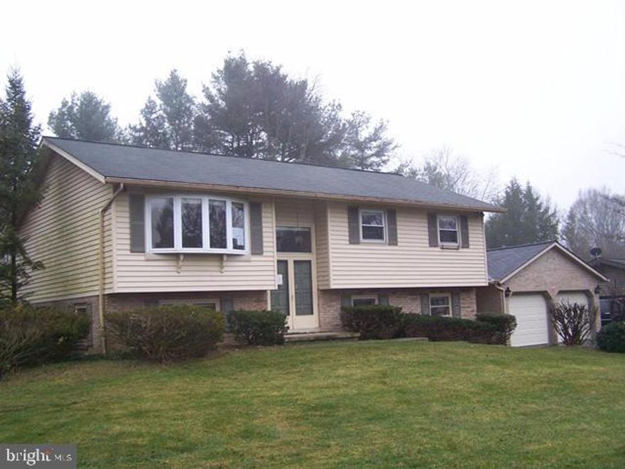Large bi-level in quiet mature neighborhood in Manheim Township featuring 3 Bedrooms & 2.5 baths and walking distance to school. Includes large combo Living Room and Dining Room leading to Sunroom w/ vaulted ceiling & large open Kitchen. Master Bedroom w/ full bath, large lower level family room W/ built in cabinets and half bath extra large utility room & breezeway leading to large 2 car garage. Semi private backyard & much more. Great potential