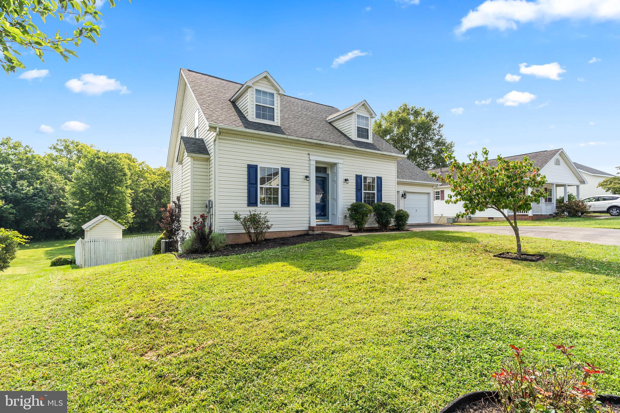 Welcome to this attractive Cape Cod-style home located in the sought-after neighborhood of Dry Run Commons, known for its serene walking trails and beautiful views of the woods and stream. The neighborhood also has a playground and basketball court offering the perfect blend of activity and recreation! This well-maintained home blends classic charm with modern updates for comfortable, versatile living. Inside, you’ll find a bright kitchen equipped with newer stainless steel appliances, perfect for everyday cooking and entertaining. The adjacent dining room features a large window overlooking the private backyard with a wooded buffer, creating a peaceful backdrop for meals. The family room boasts vaulted ceilings, neutral wall colors, and a cozy natural gas fireplace that has been recently evaluated and is in excellent working condition. A main-level guest bedroom and full bath offers convenience, while the upper level, primary bedroom offers privacy and features a full bath with a luxurious jetted soaking tub. A versatile loft area can serve as an office, nursery, or additional bedroom. Enjoy outdoor living on the expansive back deck—ideal for grilling—or unwind on the lower back patio just off the walkout basement. The partially finished basement provides ample storage and includes a large finished room that can be used as a guest suite, primary bedroom, or in-law suite. Additional features include a fully fenced backyard with a fire pit, a 2-car garage that’s drywalled, insulated, and has a sealed and painted floor, plus a workbench.
Major updates have been completed for your peace of mind:
Plumbing and electrical systems evaluated and updated
Radon mitigation system installed
HVAC system only 1 year old
Hot water heater only 5 years old
Don’t miss your chance to own this warm and inviting home with flexible living space and a beautiful natural setting.