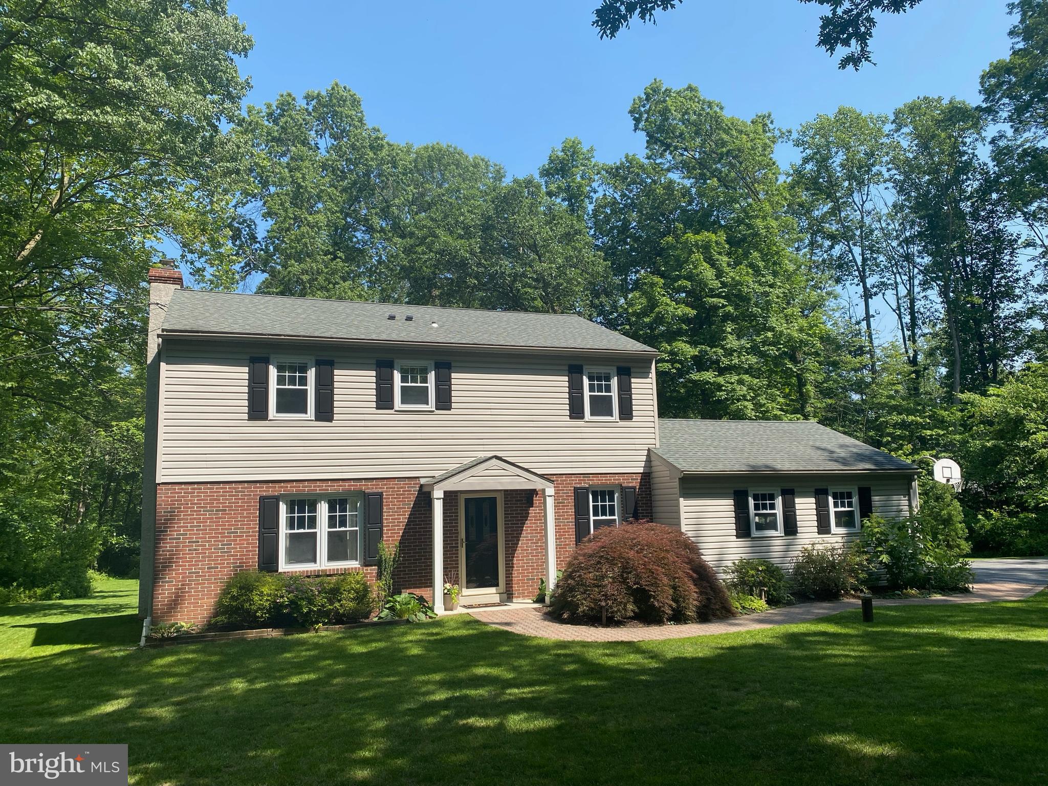 Ahh, this is a private, wooded retreat in the award-winning Owen J Roberts School District. Located just around the bend from French Creek State Gamelands, 40 Grays Ln is happily tucked at the end of a cul-de-sac on a beautiful, parklike 2-acre property. The classic center-hall Colonial home offers a stylishly designed floorplan with a newly renovated open-concept living and dining room, a dedicated home office with a pocket door, and a completely remodeled kitchen. Timeless design and a beautiful entertaining space - the kitchen features subway tile backsplash, chic white cabinetry, stainless steel appliances and a large storage pantry. Nearly every space unites charm and style with a brick fireplace in the dining room, exposed wood beam, all new flooring throughout the main living level, fresh paint throughout, and an updated 1st floor powder room with shiplap walls. Upstairs, there are 4 bedrooms and 2 full baths, including a spacious owner’s retreat with an en suite bathroom. One of the hall bedrooms features a chair rail, adding a distinctive touch, and would make a wonderful home office if 4 bedrooms aren’t needed. 40 Grays Ln also has an unfinished basement offering excellent storage, and there’s a 2-car side entry garage, and this home also has a hookup for a portable generator. The backyard is an entrancing oasis, completely surrounded by mature trees and woodland where you can enjoy the privacy of a large back deck and custom brick patio. A peaceful spot for some quiet nature watching, and plenty of space to host a backyard BBQ. Plus, there are a number of outdoor adventure spots nearby, including French Creek State Park, Crow’s Nest Preserve, and Warwick Park to name a few. With abundant wildlife and bird watching opportunities, this location is a sportsman’s delight. You’ll have hiking, biking, boating, kayaking, hunting and fishing opportunities at your fingertips. You’ll also be nearby the historic St. Peter’s Village, and you’ll have convenient access to Rte 23 and Rte 345. This is a lovingly cared for, updated home in a pristine location. Request a personal tour today!