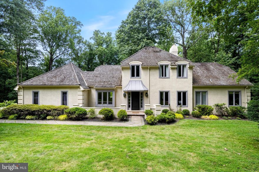 This 5BR/4.5 beautifully updated, spacious French colonial has a beautifully updated primary suite on the main level, a gorgeous new high end custom kitchen, new wood floors throughout main floor, newer HVAC and hot water, a cedar roof with at least 15 years of life left (letter from roofer) – AND a huge deck with hot tub and charming stone patio to enjoy views on of private 2 acre lot – AND it is on a cul de sac street in a nice Tredyffrin neighborhood – top ranked TE schools!! Wow! This special home which was built by premier Main Line Builder Pohlig Builders, and designed by Ann Capron, has 3 fireplaces (FR, primary BR, lower level family room), a nicely finished walkout lower level with fireplace and full bath, gorgeous curb appeal with the sweeping driveway and bucolic landscaping, beautiful custom built-ins, a beautiful 2 story entry, and a first floor private office.  The stucco on this home is masonry stucco and was fully tested by owner and has no issues!!  Report available upon request. The main floor has wood floor throughout and consists of the dining room, living room with custom built-ins, family room with gas fireplace and built-ins that is open to the breakfast area and gorgeous custom kitchen.  The eat-in Kitchen has quartz countertops, white subway tile back splash, Thermador and Subzero appliances, under cabinet and in-cabinet lighting, an breakfast bar/ island that seats 3, and lots of pantry space. The laundry was also renovated with new cabinets, floor and has a nice large closet for storage plus a door to the deck.  The primary suite with gas fireplace, large window with views of property, walk in closet, luxury bath with stand-alone soaking tub; private office and powder room complete this level. The over-sized deck with hot tub is just off the kitchen and breakfast area – great for entertaining and al fresco dining!  The layout of the main floor and outside area of this home make it the ultimate space for entertaining and family living. Upstairs you will find 4 good-sized bedrooms, a hall bath, a jack and jill bath and numerous closets.  The walkout lower level has a cozy TV area with stone fireplace (gas), an eating area, a wet bar, an area perfect for a pool table or ping pong table and a convenient full bath.  There is also a huge storage area. The location of this home combines the convenience of being within 5 minutes of trains, great shopping and highways, with the serenity of being on a private, quiet lot. The best of both worlds!  Just minutes to Lifetime Fitness, King of Prussia Town Center, downtown Wayne, trains and highways, and in one of the top school districts in the country - this house has everything!