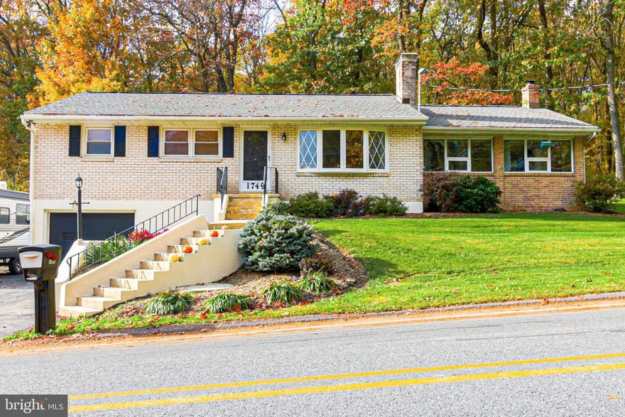 Tranquility awaits in this 3 bedroom ranch situated on a hill with mature trees just minutes from downtown Temple and a quick drive to Reading.  You'll appreciate the abundant windows into the large kitchen and dining area, as well as the flexibility of a home office and den area. A wood stove and fireplace provide auxiliary heating options and add to the warmth and charm of this home. Entertain guests on the deck with a custom outdoor fireplace or at the built-in bar and rec room in the basement. An extra deep built-in basement garage also serves as a laundry and mud-room. Plenty of storage in the is available in the basement and shed. Hardwood flooring throughout most of the home as well as updated bathrooms. Book your showing today!