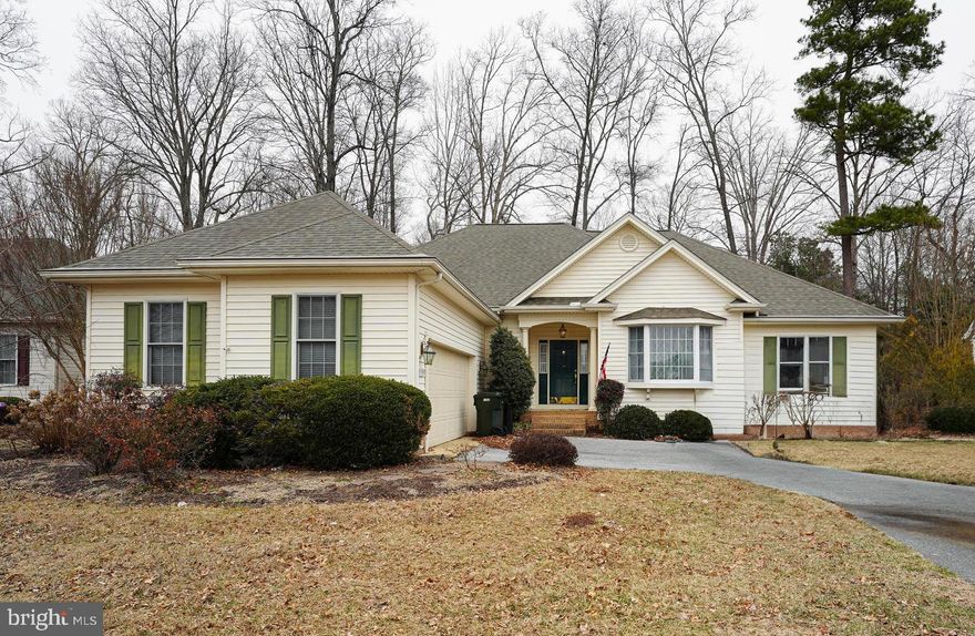 One-owner, 3BR/2BA contemporary ranch in The Villages of Sleepy Hollow - a charming, established community of winding, tree-lined streets and sidewalks with a handsome mix of home-styles. Minutes to Rt 50 / Ocean Gateway or Downtown Salisbury for unique shopping, dining, and events - but tucked away on a nice-sized homesite w/a fenced rear yard backing to trees. Warm cherry hardwood floors through the welcoming foyer, dining room, and living room. Open-concept with nice-sized rooms - perfect for entertaining. Formal dining room area with crown molding and lots of sunlight through the bay window. Living room features built-in bookshelves, gas fireplace - leads into the kitchen. Great kitchen - granite counters, ample cabinet space, ceramic tile floors. Enjoy a quick snack at the bar, or a leisurely weekend brunch in the breakfast nook, watching the backyard birds through the double-windows. Primary bedroom offers a full, en-suite bath -- double-sink vanity, soaking tub, tiled step-in shower stall, walk-in closet. 2 additional bedrooms. 2nd full bath w/tub/shower combo. Permanent stairs to the floored storage attic. Paved driveway leads to your brick-trimmed porch and side-entry attached garage. Sizes, taxes approximate