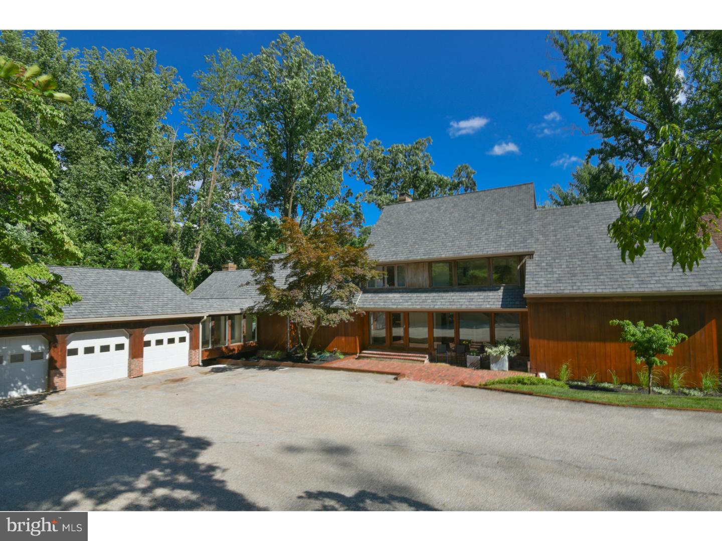 Frank Lloyd Wright and Louis Kahn would feel right at home in this dynamic custom designed contemporary on 6 peaceful acres in the heart of Gladwyne. The open floor plan, soaring ceilings and window walls create an abundance of space and natural light; just the right energy and vibe of a true modernistic home. Designed by a renown Philadelphia architect, this home has strong lines and a minimalist sensibility. Completely rebuilt from the studs up, this property offers high end finishes and top quality construction from a respected local builder. The Kitchen is the heart of the home; both polished and warm w/ its mix of materials and panoramic views. The light walnut custom cabinetry is enhanced by the Cesarstone and black walnut countertop on the expansive island. Two distinct work spaces are complimented by Wolf appliances- double ovens, microwave, warming drawer and a 6 burner gas cooktop w/an imported Italian Futura-Futra Hood, a Sub Zero refrigerator and 2 Bosch dishwashers. The Master Bath has a spa-like quality that is designed for the maximum of light and privacy with a ONE-OF-A KIND concrete double sink sitting atop custom cabinetry, Custom LED lighting, radiant heat flooring, and a Volcanic Limestone Victoria Albert Soaking Tub. Other bathrooms include Duravit or Kohler sinks, Brizio or Moen faucets and custom cabinets, countertops and lighting. Additional features include 4" White Oak quarter-sewn Riftwood flooring, custom designed closets including a 240 square foot walk in his & her closet, cat 5 wiring and custom lighting. There is a new Grand Manor CertainTeed Roof w/ new gutters, downspouts and gutter guards, new efficient propane heating system and central air conditioning, many new windows and sliding doors. So, if you are looking for a unique and special home with strong lines, one that could easily be featured in Architectural Digest or Elle Decor Magazine, this home is definitely for you!