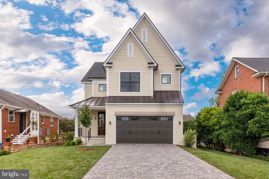 Finished and ready to move in! American Signature Properties by Wormald presents this beautiful new custom home in the Lyon Park neighborhood of North Arlington. Located on a large, flat lot on a quiet street, this home features 5 bedrooms and 4.5 bathrooms with 4,531 square feet of finished living space on three levels. The main level includes 9ft ceilings, gorgeous red oak hardwood floors, and a beautiful gourmet kitchen with quartz countertops, maple cabinetry, stainless steel Bosch appliances, and fine finish details. Off of the kitchen is a great room with built-ins and a gas fireplace with wood mantel and tile surround. Overlooking the backyard is a deck with Trex flooring that is perfect for grilling.  A private study, elegant formal dining room, and spacious two-car attached garage complete the main level. The upper level is highlighted by a luxurious primary suite with dual walk-in closets, and a spa-like bathroom with double vanities, stand-alone soaking tub, and heavy glass enclosed shower. The lower level includes a spacious recreation room with wet bar, finished storage area, and additional bedroom with full bathroom. Convenient to Lyon Park and Zitkala-Sa Park, and under a mile to Clarendon Metro and everything else in the heart of Clarendon.