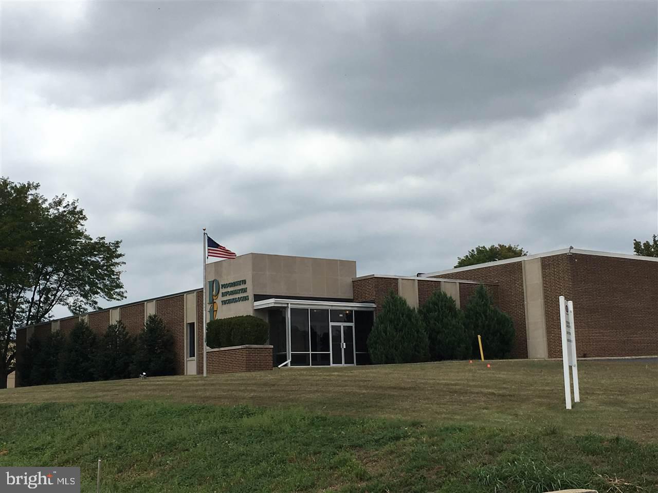 Commercial industrial property for sale located within the York County Industrial Park. Sale consists a 3.44 acre parcel with a 26,534 square foot building, and an adjacent 2.99 acre vacant lot (Parcel ID 67-36-000-LI-0001-C0-00000). Building was built in 70-71 and addition in 80-81 for the Magnus Group which is a typographer and typesetting business. Building is best suited for light manufacturing, office, call center, research & development, lab, technology center, or other similar users. Many permitted uses by right. Layout consist of many individual rooms and work ares throughout the building and large room with accessible raised floor systems. 1 pair of restrooms, 1 8' X 8' dock, 150 vehicle parks, Baldor model IDLC 350-D 350kW capacity diesel generator, Toshiba 30 kVA battery backup UPS, two electric services of 800A & 400A/240V/3Phase.