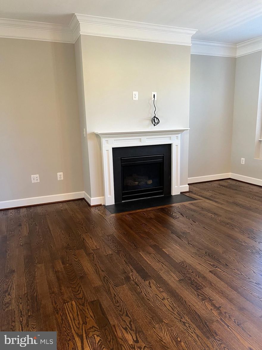 Bright and open end-unit townhome with numerous upgrades in a desirable location. The main level features wide-plank hardwood flooring and a well-appointed kitchen with stainless steel appliances, granite countertops, a large island, and ample cabinet space. Additional features include a two-car garage.