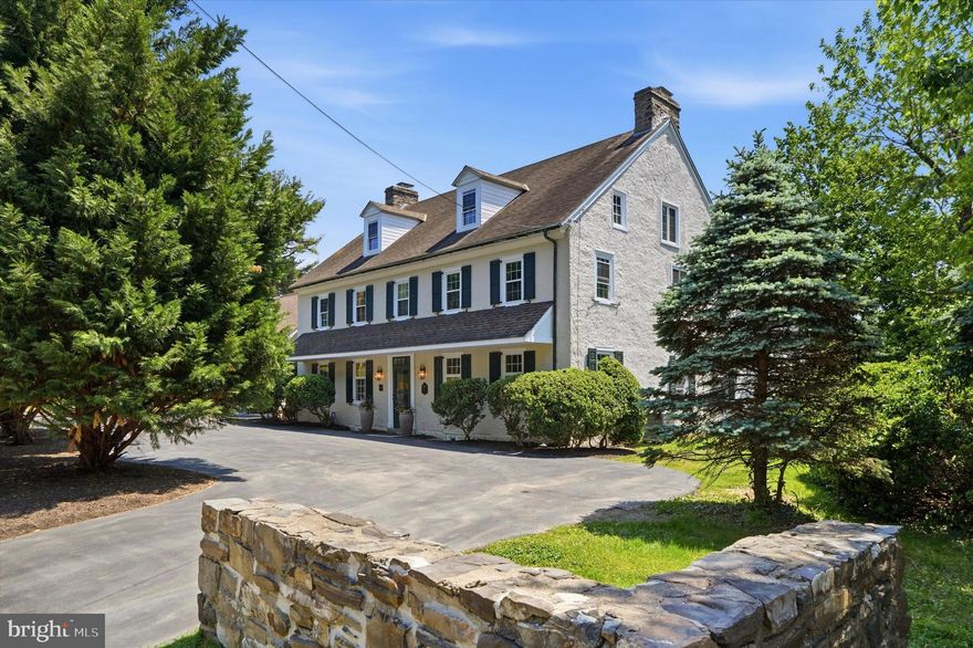 500 E. Mill Road is a beautifully restored historic residence that blends timeless character with thoughtful modern updates, set among some of the area’s most sought-after historic homes. Dating back to the early 1800s and once associated with the historic Sunnybrook estate, this remarkable stone home offers a rare combination of history, craftsmanship, and modern livability.
A wide center hallway welcomes you into the home, where the dining room and kitchen are set just off to one side and multiple living and entertaining spaces unfold to the other. The kitchen features Bosch appliances and generous space for everyday living and entertaining. Just steps away, a walk-in pantry with a second refrigerator provides additional storage and convenience.
Toward the rear of the home is the great room, part of the original structure, offering a true sense of history highlighted by exposed wood beams and a massive fireplace, a defining focal point of the space. A separate mini bar off the great room creates an ideal setting for entertaining.
Upstairs, the spacious primary suite features a separate sitting area, walk-in closet, and an ensuite bath with heated floors. Two spacious secondary bedrooms, a shared bath, and convenient second-floor laundry complete the level.
The third floor offers two additional bedrooms and a shared bathroom, providing excellent options for guests, home office, or extended living needs.
Throughout the home, original details, including wide-plank hardwood floors, multiple fireplaces, custom millwork, and built-ins, have been carefully preserved and paired with tasteful renovations designed for today’s lifestyle. The newly added two-car garage connects to a functional mud room entry. Additional modern conveniences include multi-zone central air conditioning.
Set on beautifully landscaped grounds with mature plantings, this home presents a rare opportunity to own a truly special historic property thoughtfully updated for modern living.
