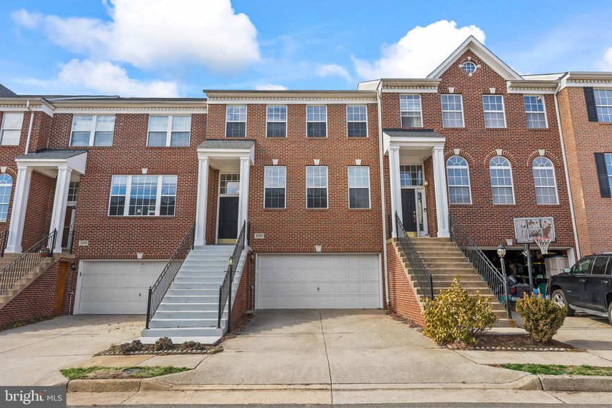 This beautiful brick-front townhome offers 4 bedrooms and 3.5 baths in a quiet, friendly neighborhood. Inside, gleaming hardwood floors flow through an open layout that includes a dining area, a cozy sitting room, and a family room with a fireplace right off the kitchen. The bright breakfast nook overlooks the deck, making it a perfect spot to enjoy your morning coffee. Upstairs, the spacious primary suite features a walk-in closet and a luxurious ensuite bath. The lower level offers a flexible space the options for the space are limitless. Outside, the deck is great for relaxing or entertaining, and the two-car garage provides plenty of storage, including built-in shelves that stay with the home. Major updates include a 30-year architectural-grade roof installed just three years ago and a new hot water heater in 2022. Just a short walk to the neighborhood tot lot and gazebo and close to all the shopping and dining in Ashburn Village, this home is ready to welcome you!