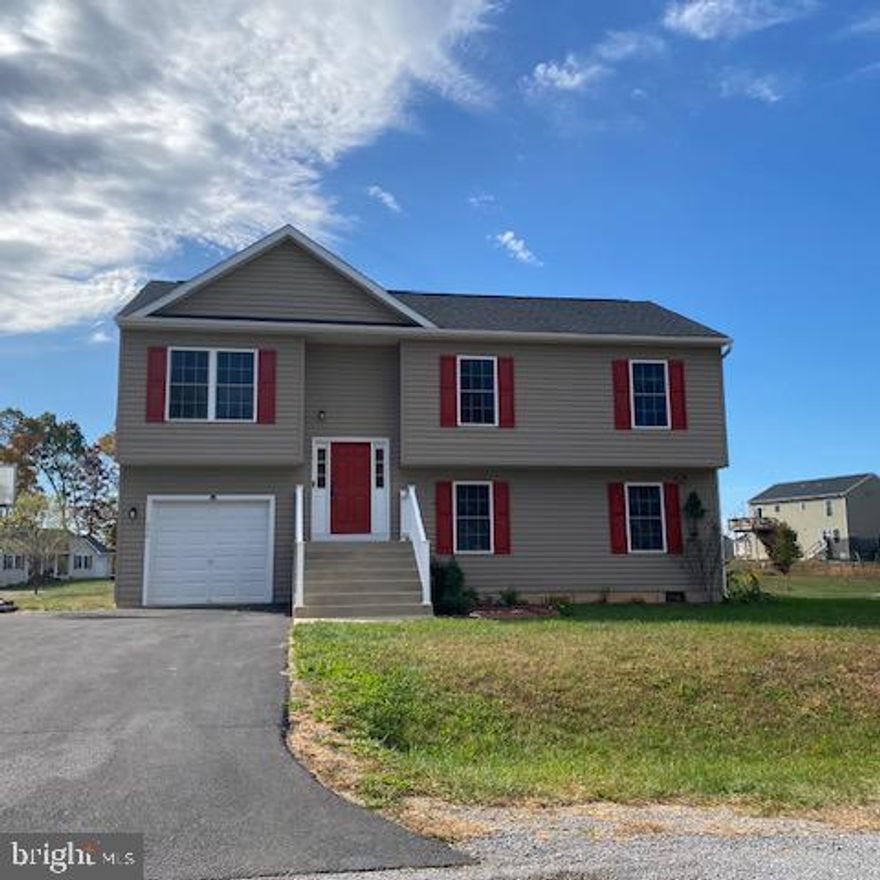 Ready to move into, this 4 bedroom, 3 bath home has been recently updated.  Freshly painted and brand new carpeting has been installed.  HVAC system has recently been serviced, insulation added in crawl space, garage door weather stripping has been replaced and a new light fixture has been installed in the utility room.  Easy care laminate floor in  living /dining and kitchen.  Island kitchen with stainless steel appliances.  Lots of storage closets.  Daylight Bedroom and private bath with large,  rec room in lower level are great for extended family or guest space.  Nice corner lot conveniently located  in the North end of Martinsburg/Berkeley Co. You don't want to miss this one, so call today to visit.  Ready for a quick closing!